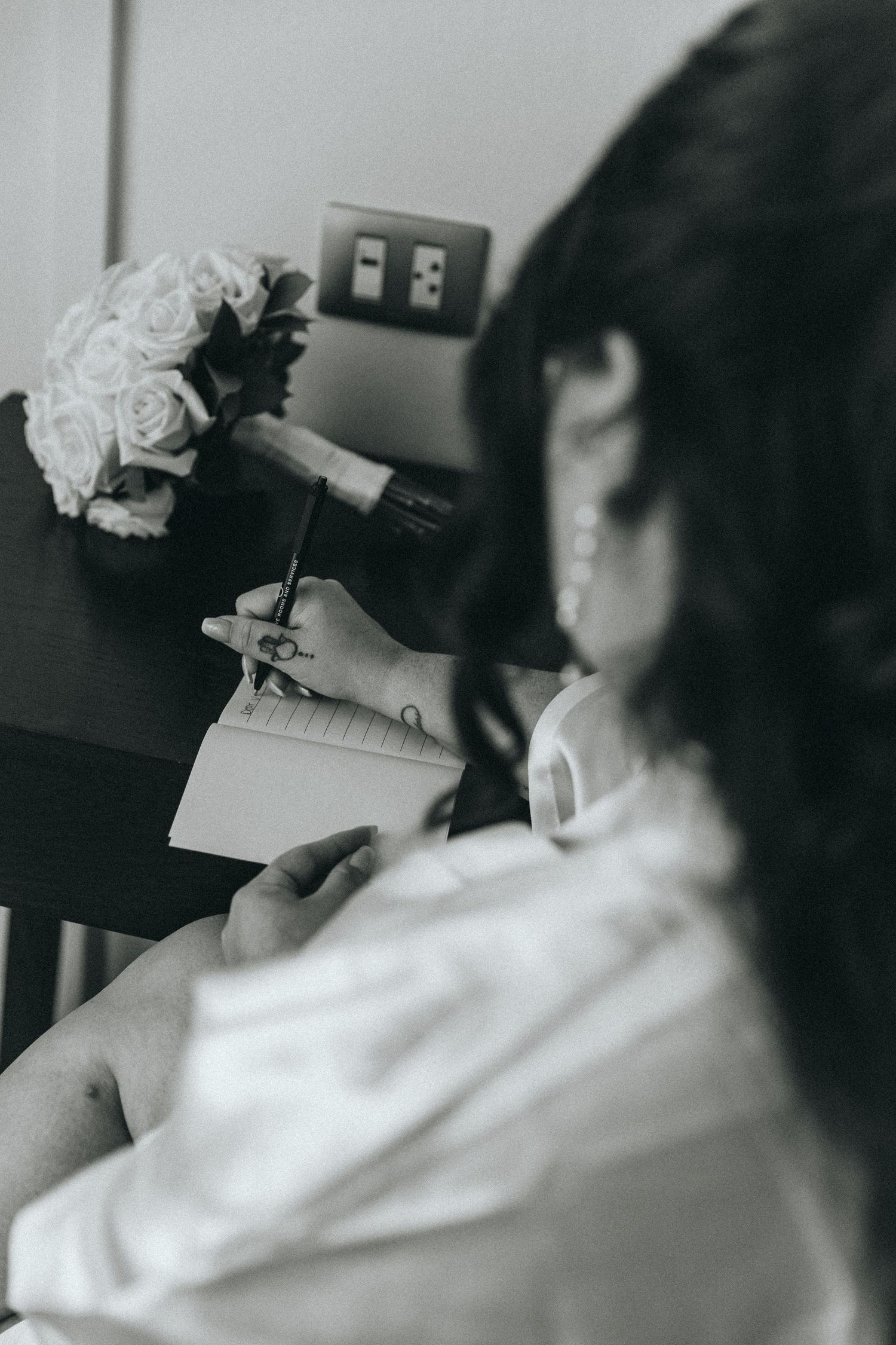 Black and white image of wedding preparation details.