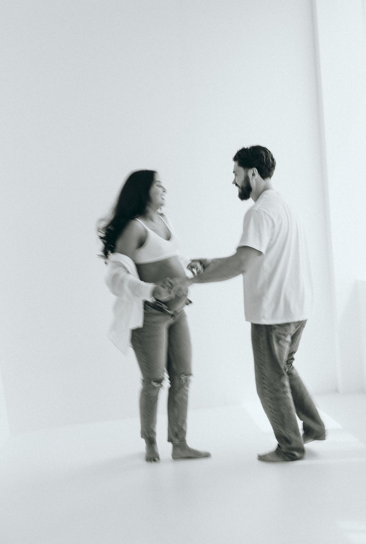 Minimalist black and white photo sequence showing a couple's playful interaction.