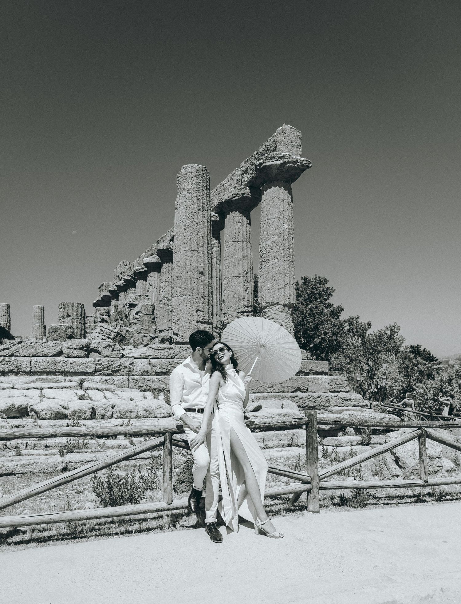Romantic photo series captured against ancient Greek architecture and stone columns.
