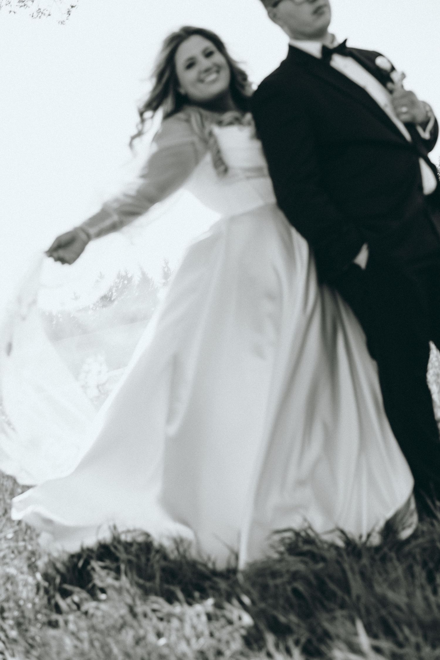 Black and white artistic wedding photos showing movement and joy.