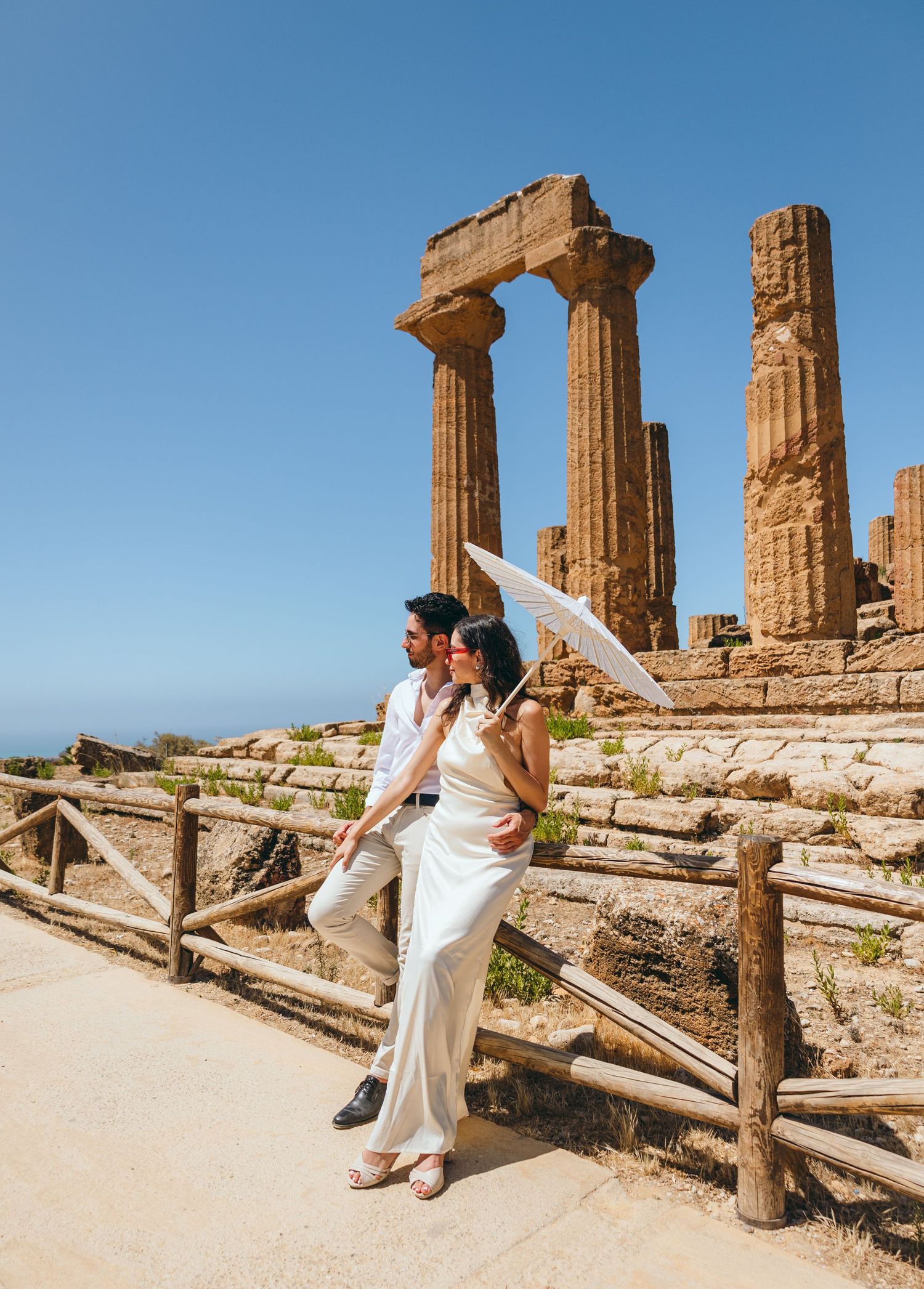 Romantic couple photography session at Valley of Temples featuring ancient Greek architecture.