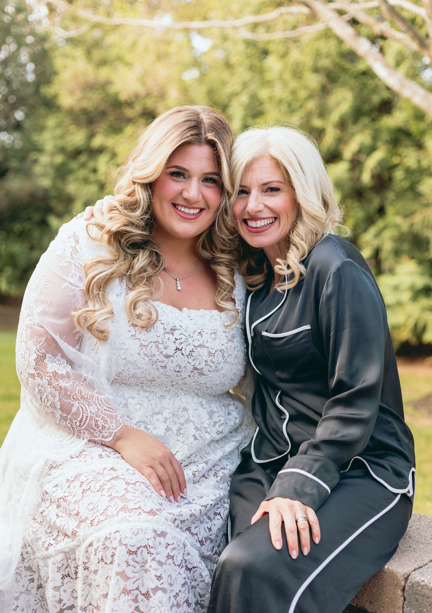Joyful outdoor portraits featuring elegant white lace and dark formal wear.
