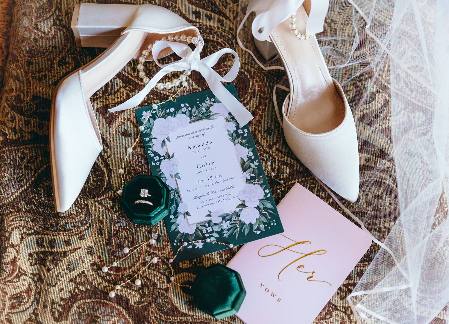 Wedding invitation suite with white shoes and emerald green accents.