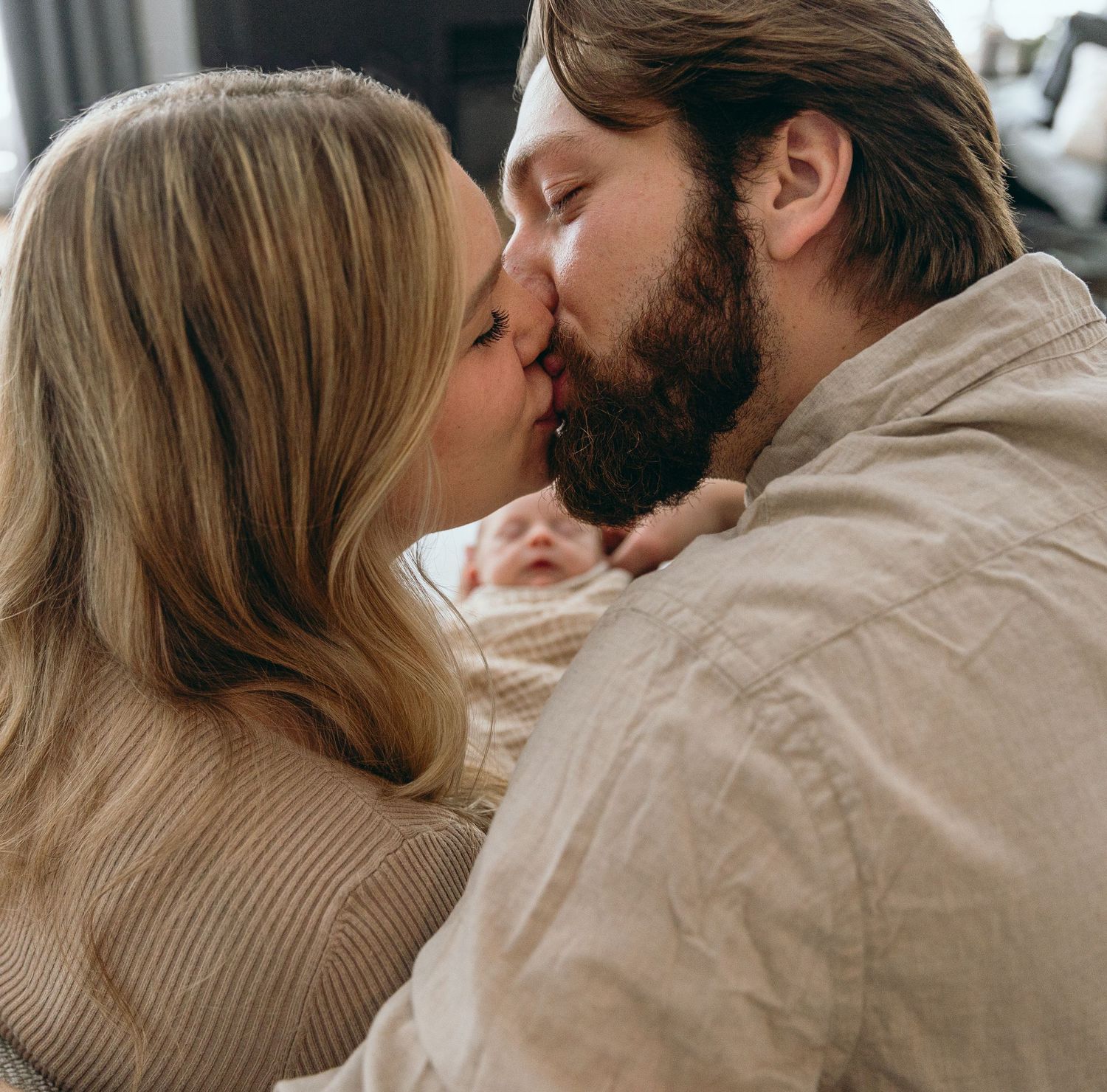 Intimate couple portrait series in warm neutral tones.