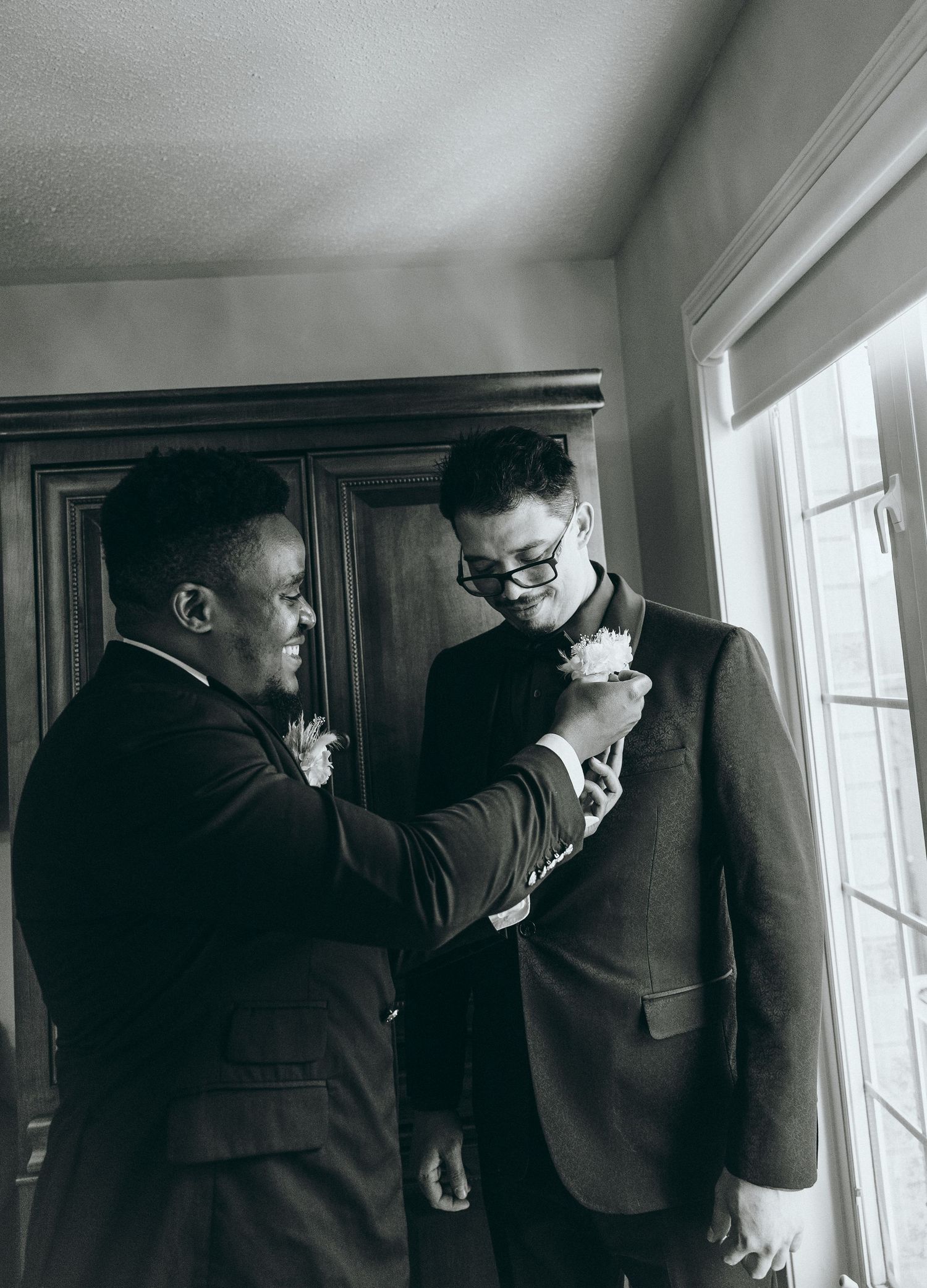 Intimate black and white photography capturing emotional wedding day moments.