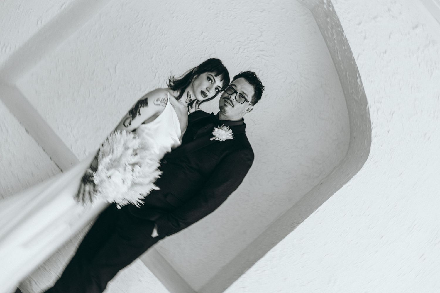 Artistic black and white wedding portrait sequence showing romantic moments.