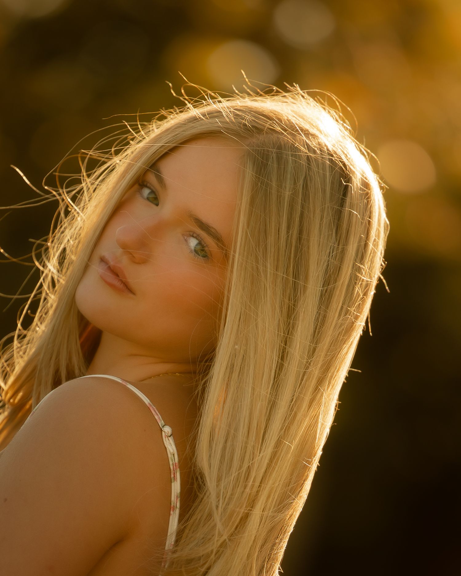 Golden hour portrait series with soft backlighting and warm tones.