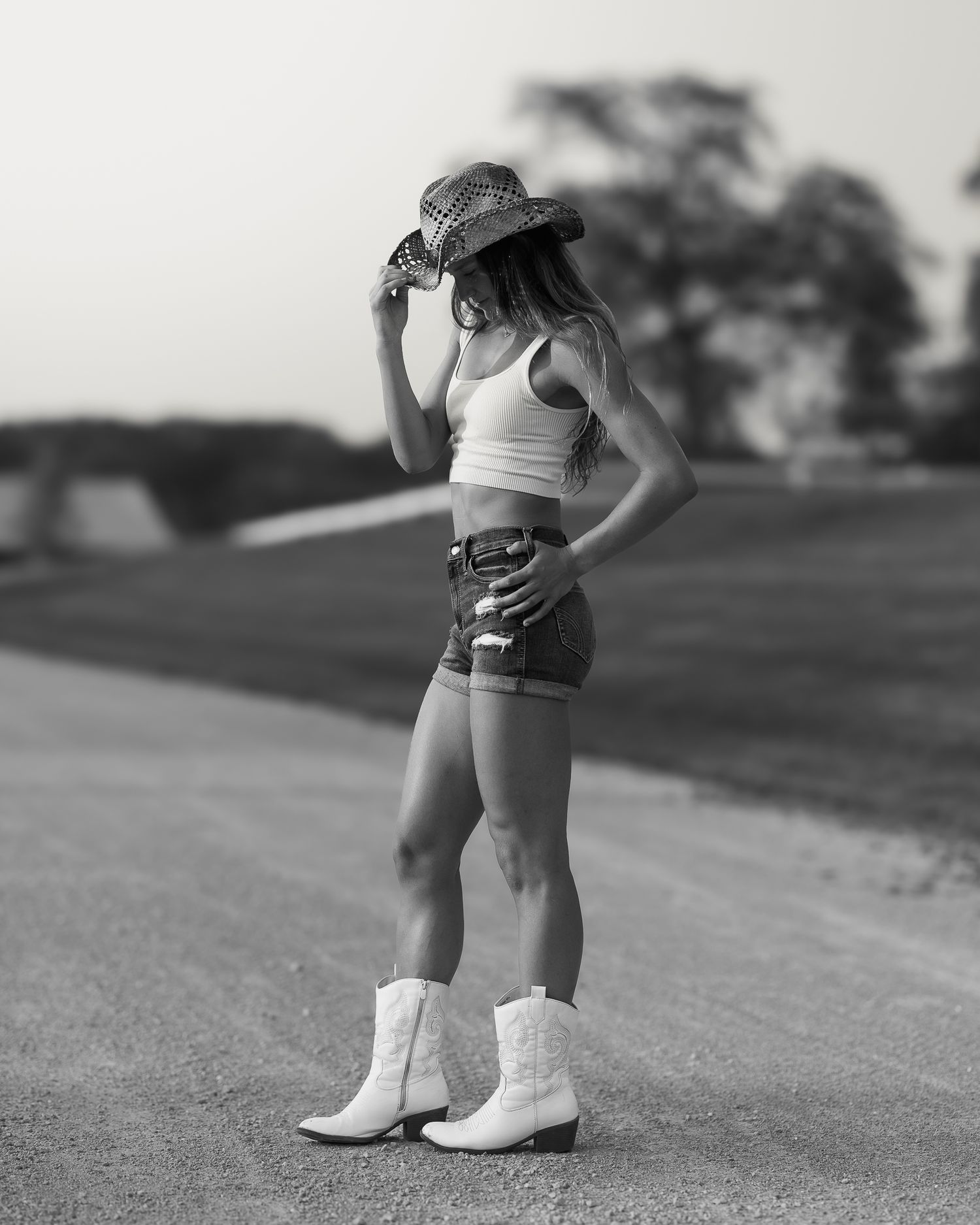 Black and white photos of boots and athletic wear during outdoor shoot.
