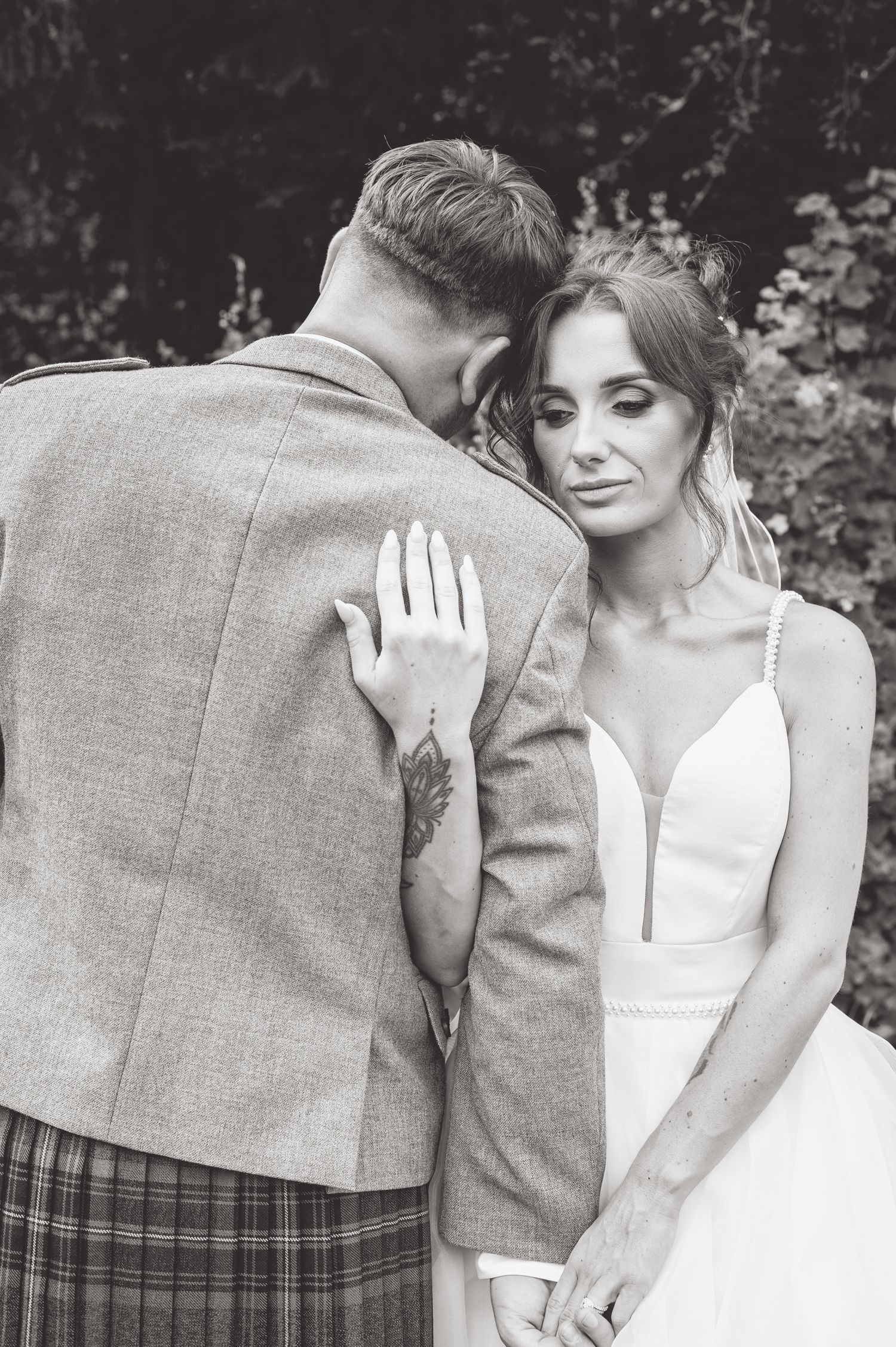Artistic black and white series of romantic wedding couple moments.