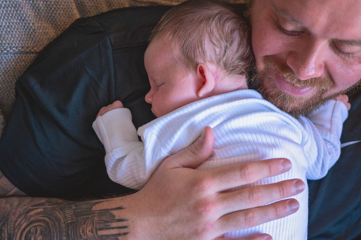 A parent holds and comforts a crying newborn baby in a series of tender moments.