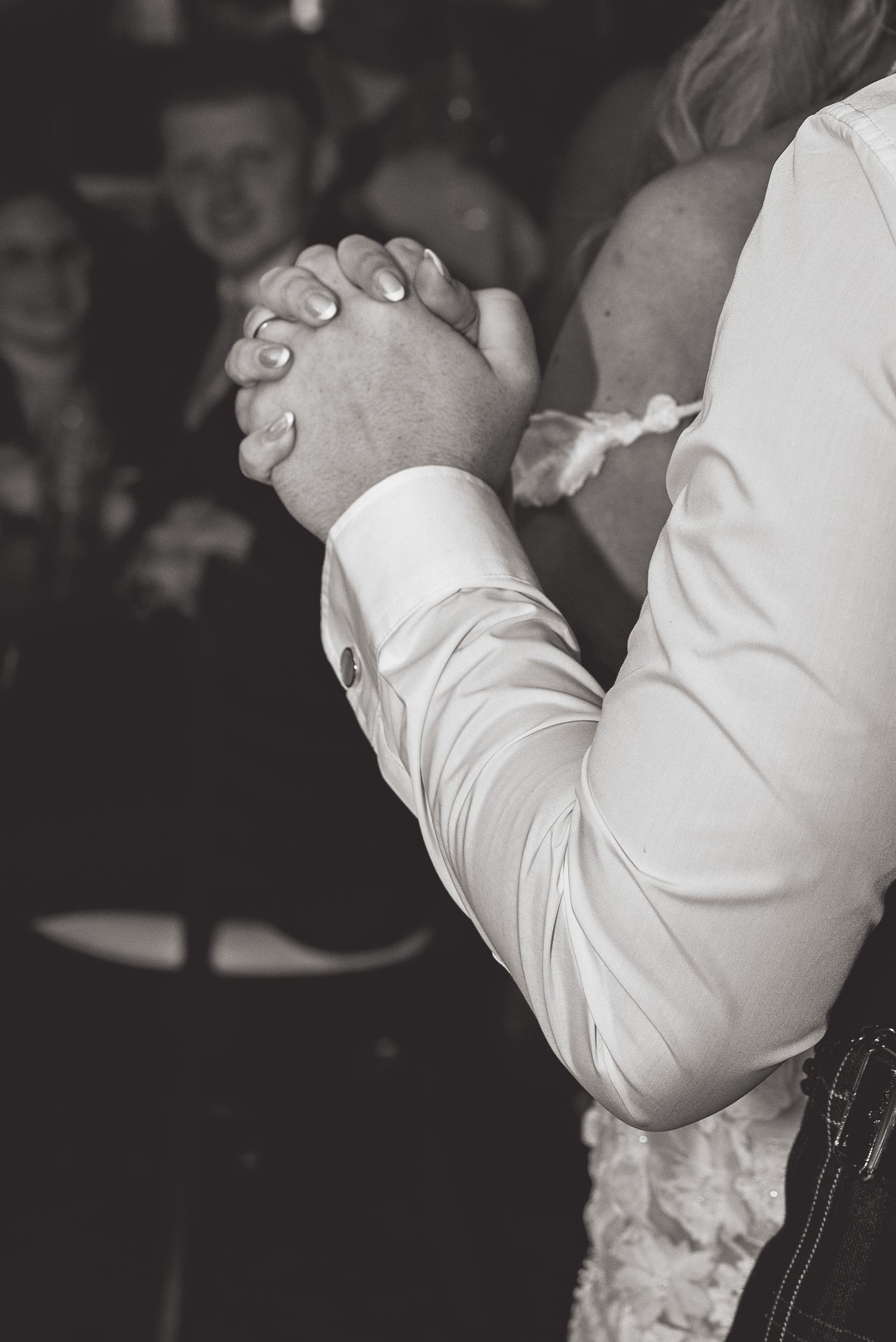 Close-up black and white shots of intimate dance floor moments.