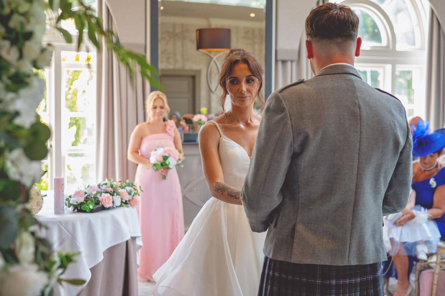 Wedding couple shares their first dance in an elegantly decorated reception venue.