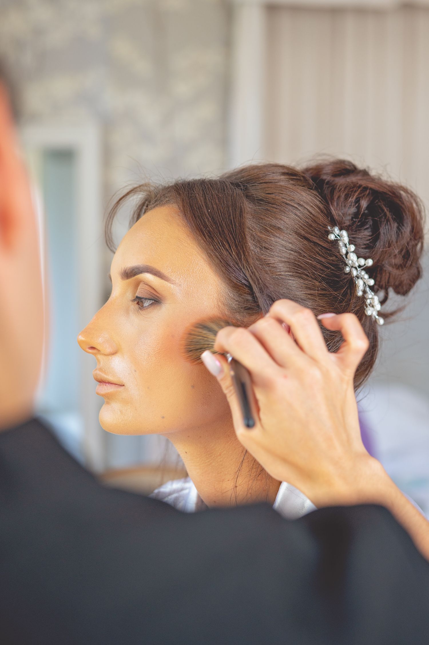 Close-up shots of wedding hair styling with delicate hair accessories.