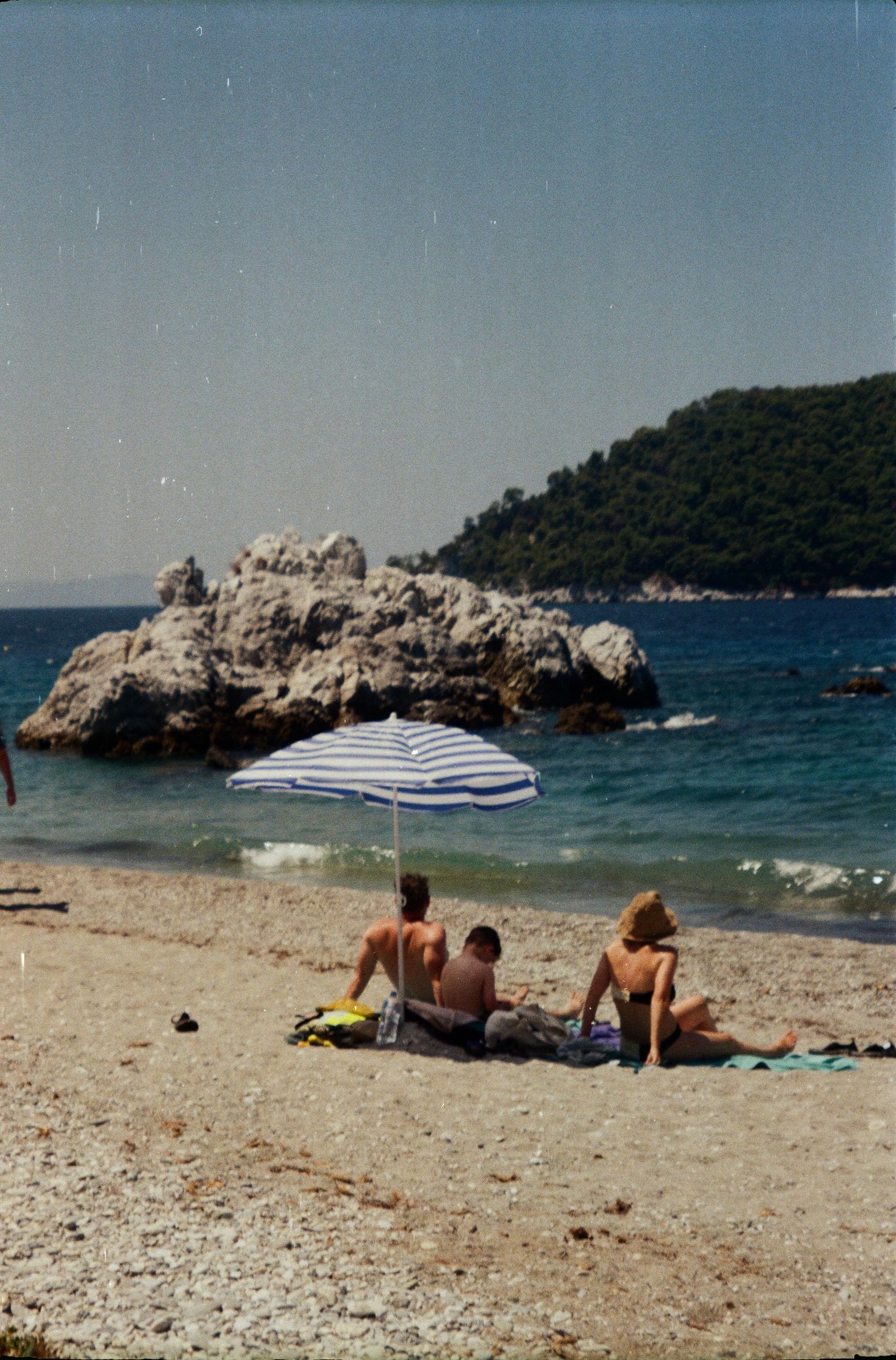 Travel film photography in Greece, umbrellas and beach days captured on Kodak Gold 200.