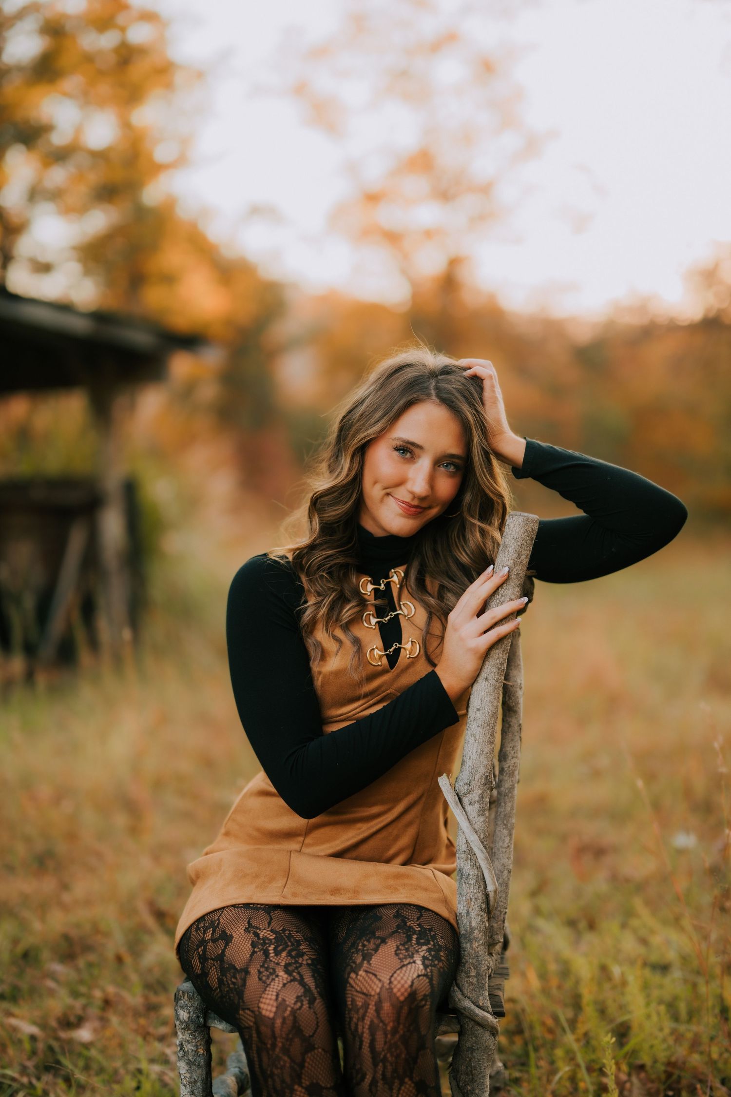 Autumn outdoor portrait session featuring brown dress and lace details in natural setting.