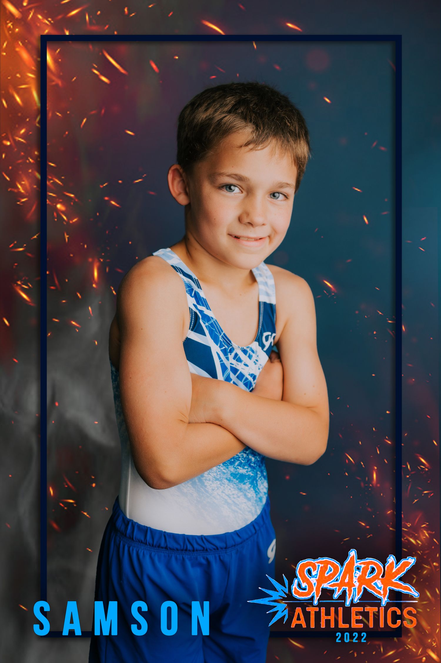 A young gymnast in a blue and white leotard poses confidently against a dark background with sparks effect for Spark Athletics.