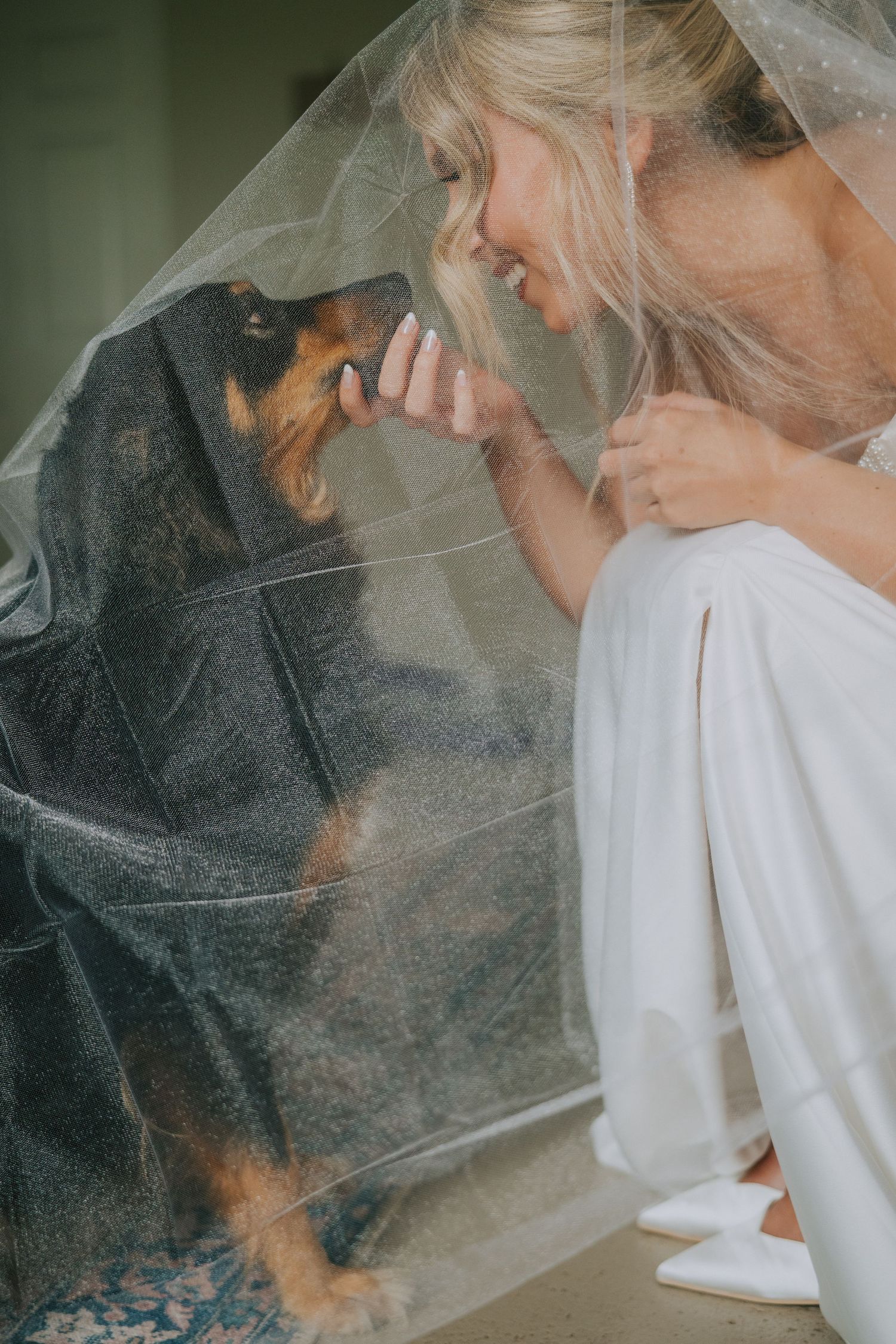 Artistic sequence of a bride getting ready with veil and white dress in soft natural light.