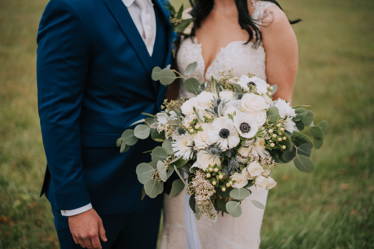 Elegant wedding portraits featuring white and green floral bouquets against a garden backdrop.