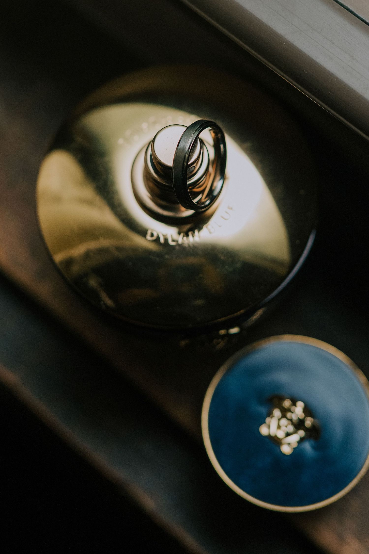 Close-up shots of wedding rings with artistic lighting and reflections.