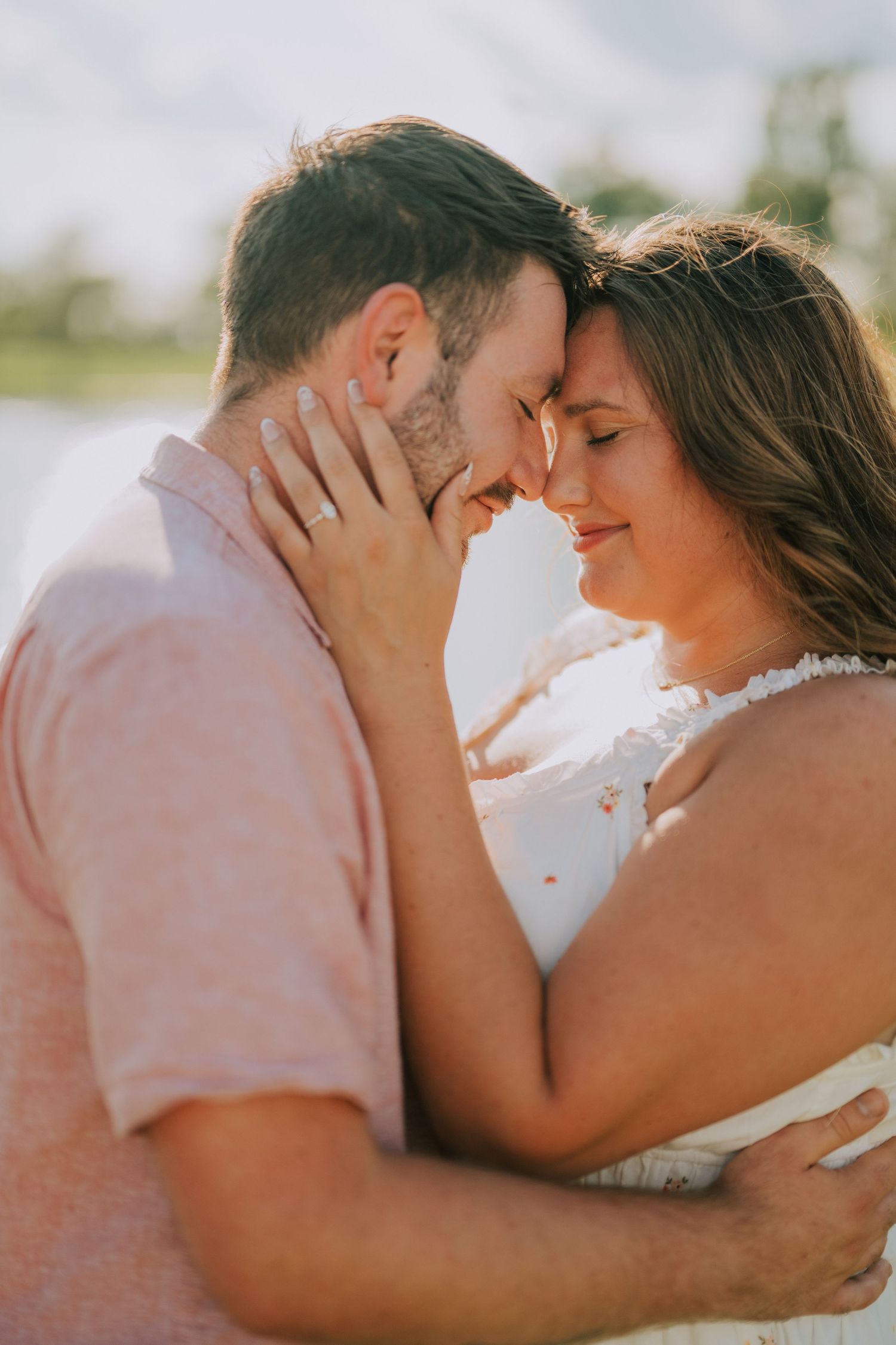 Intimate close-up shots of couple sharing romantic moments in sunlight.