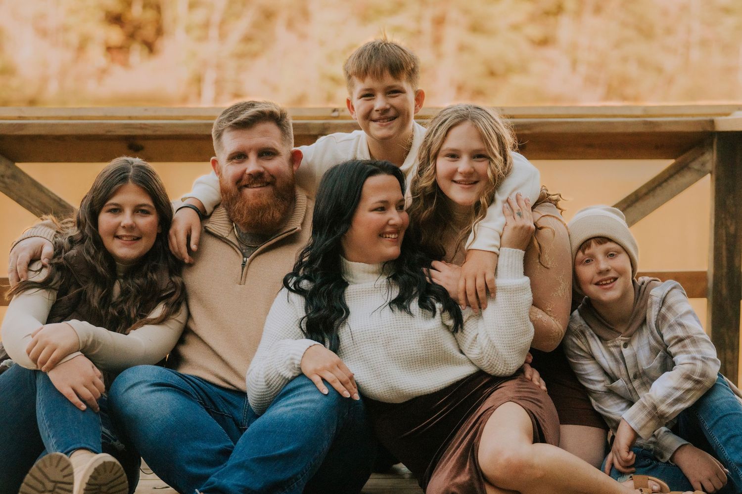 Candid family moment captured on couch during indoor photo session.
