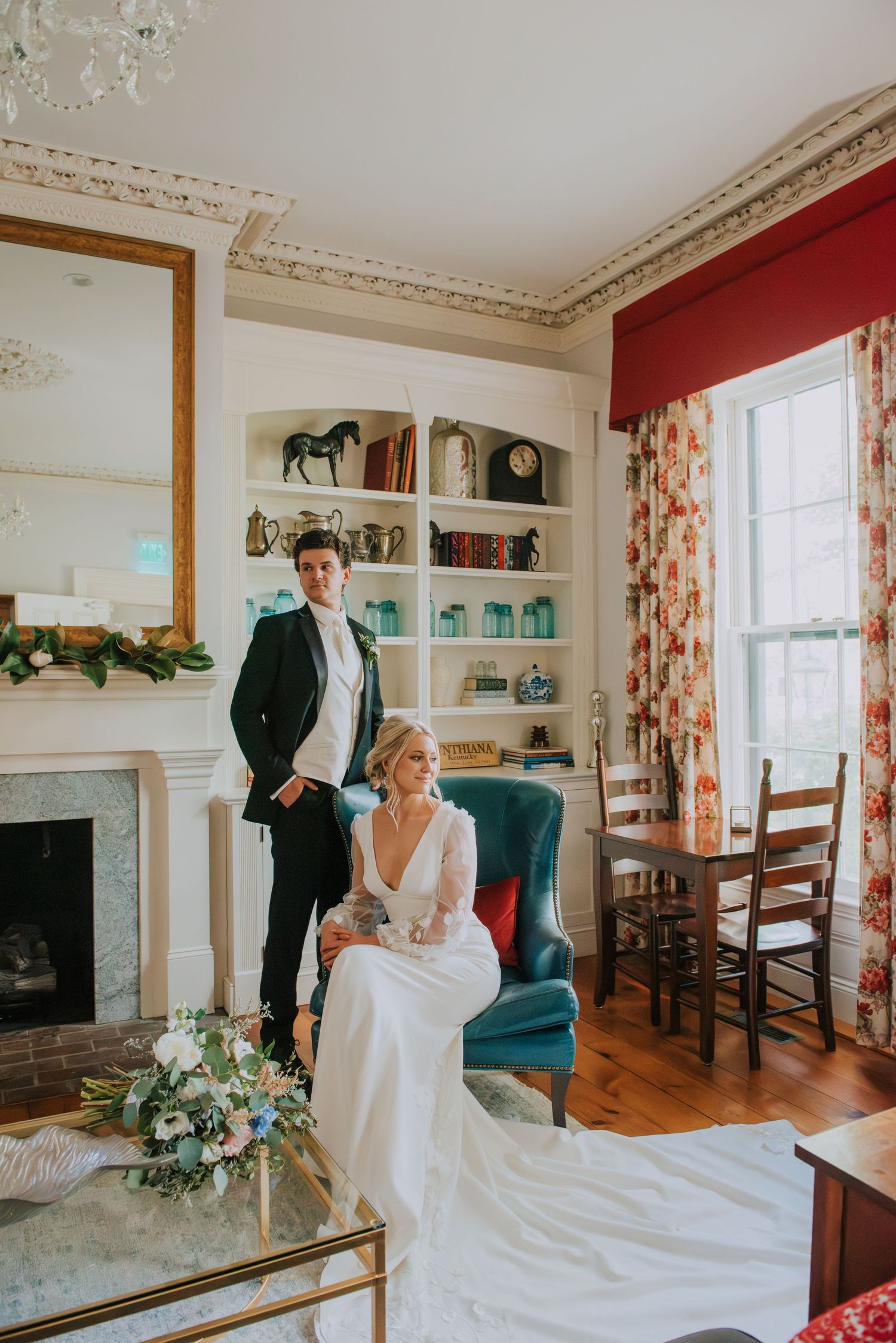 Elegant wedding photo session in a vintage-styled room with ornate decor and natural lighting.