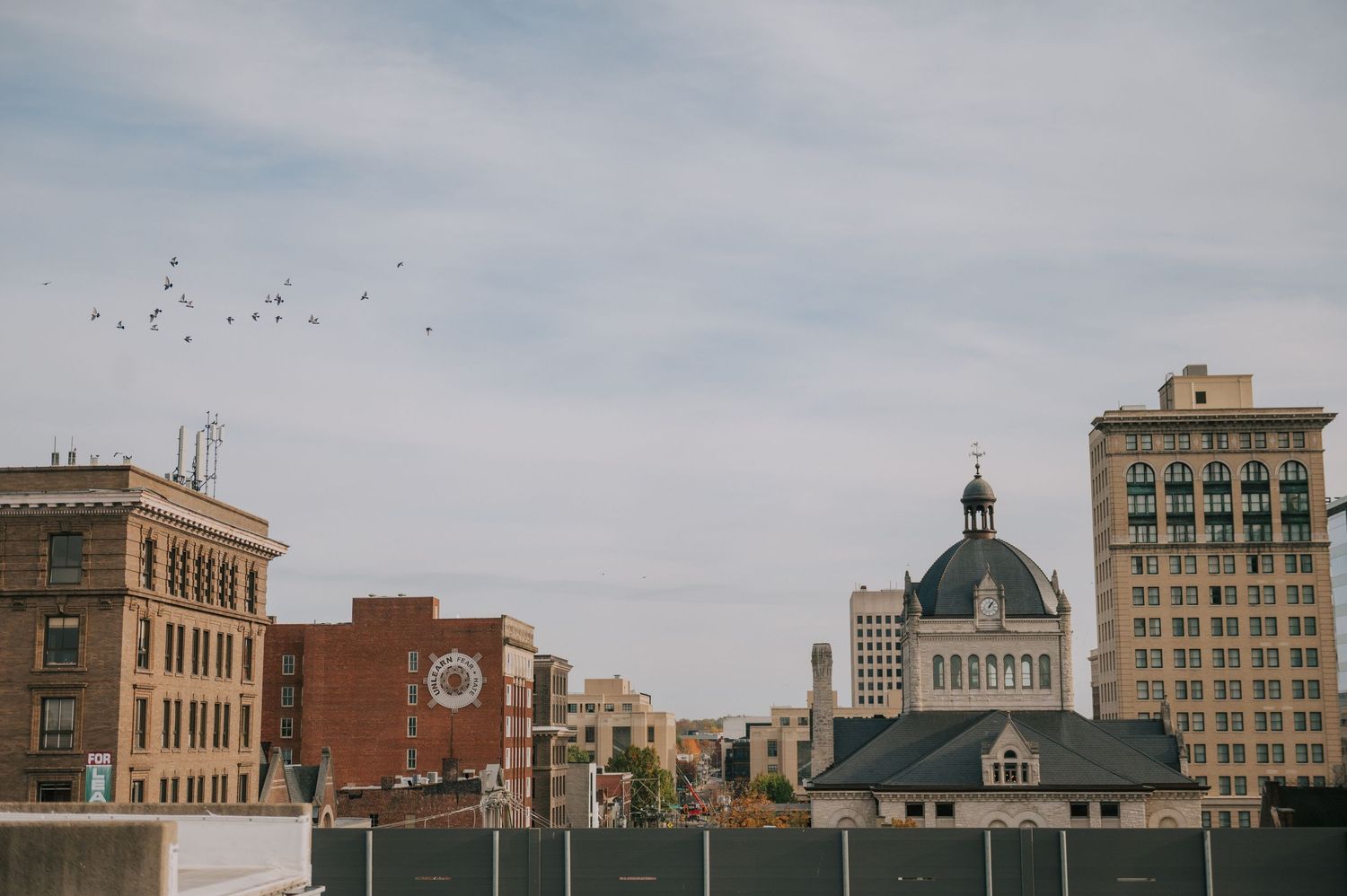 Panoramic cityscape view of historic downtown buildings and architecture.