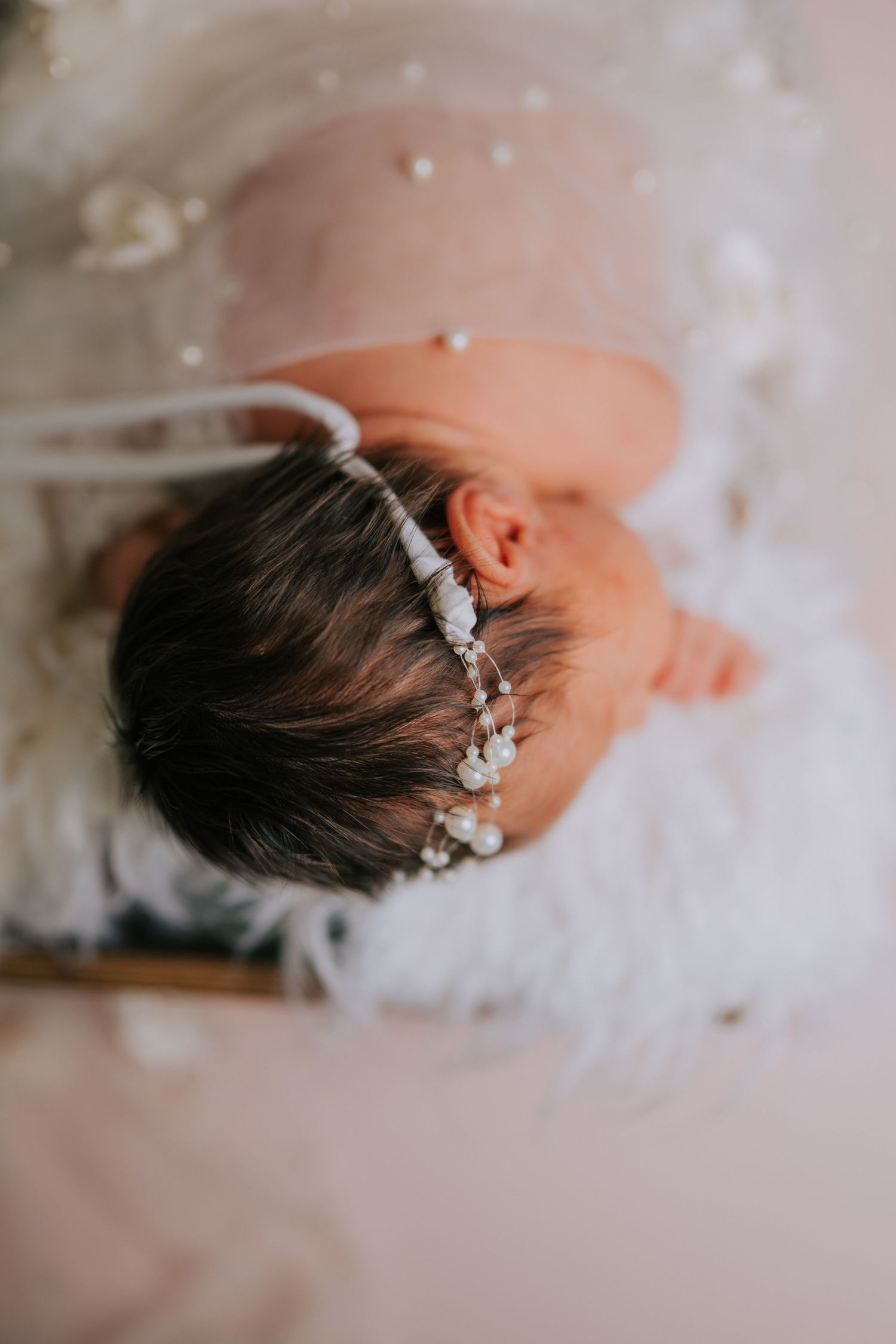 Close-up views of delicate silver hair accessories against soft white background.