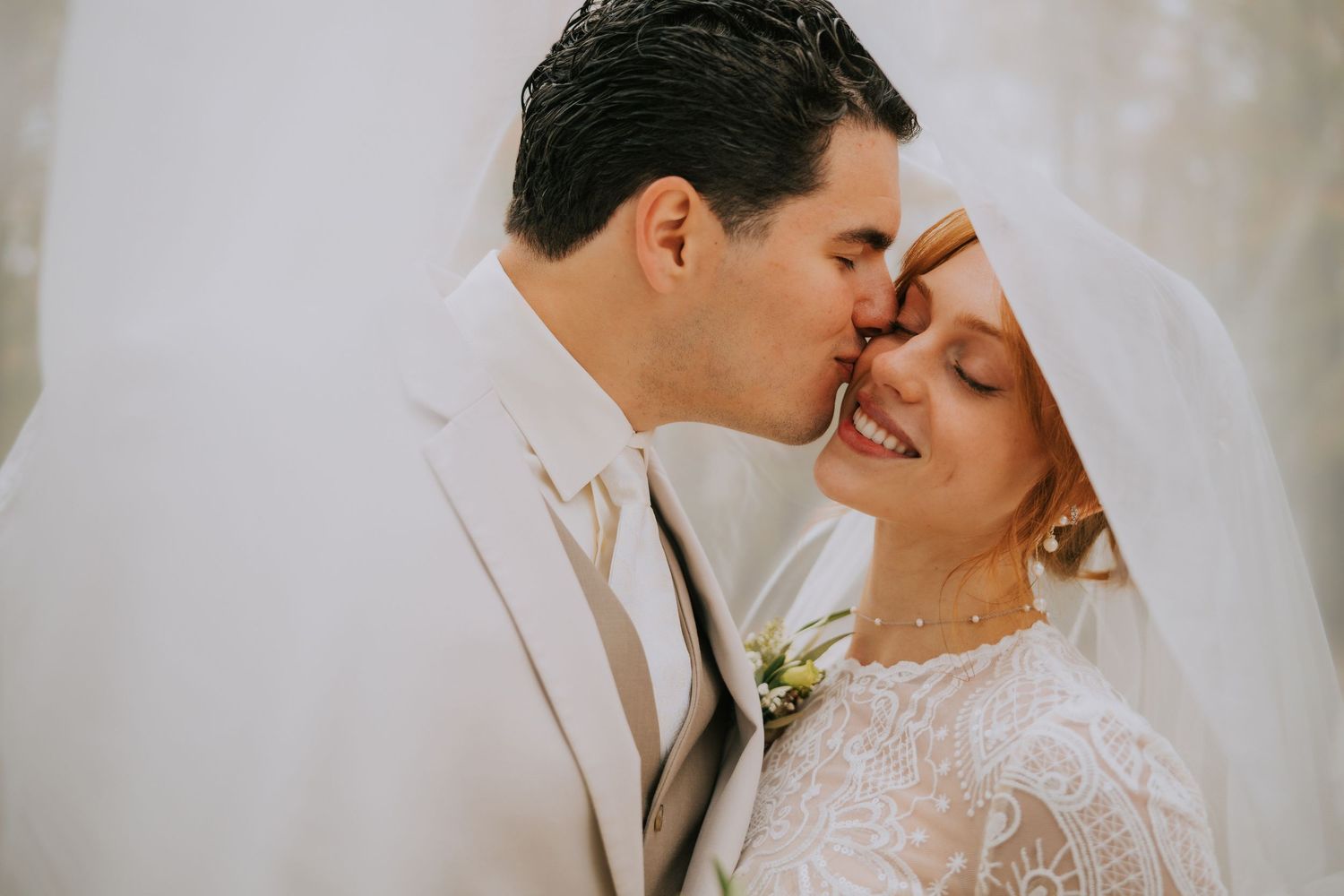 Close-up romantic wedding portraits in soft, dreamy lighting.