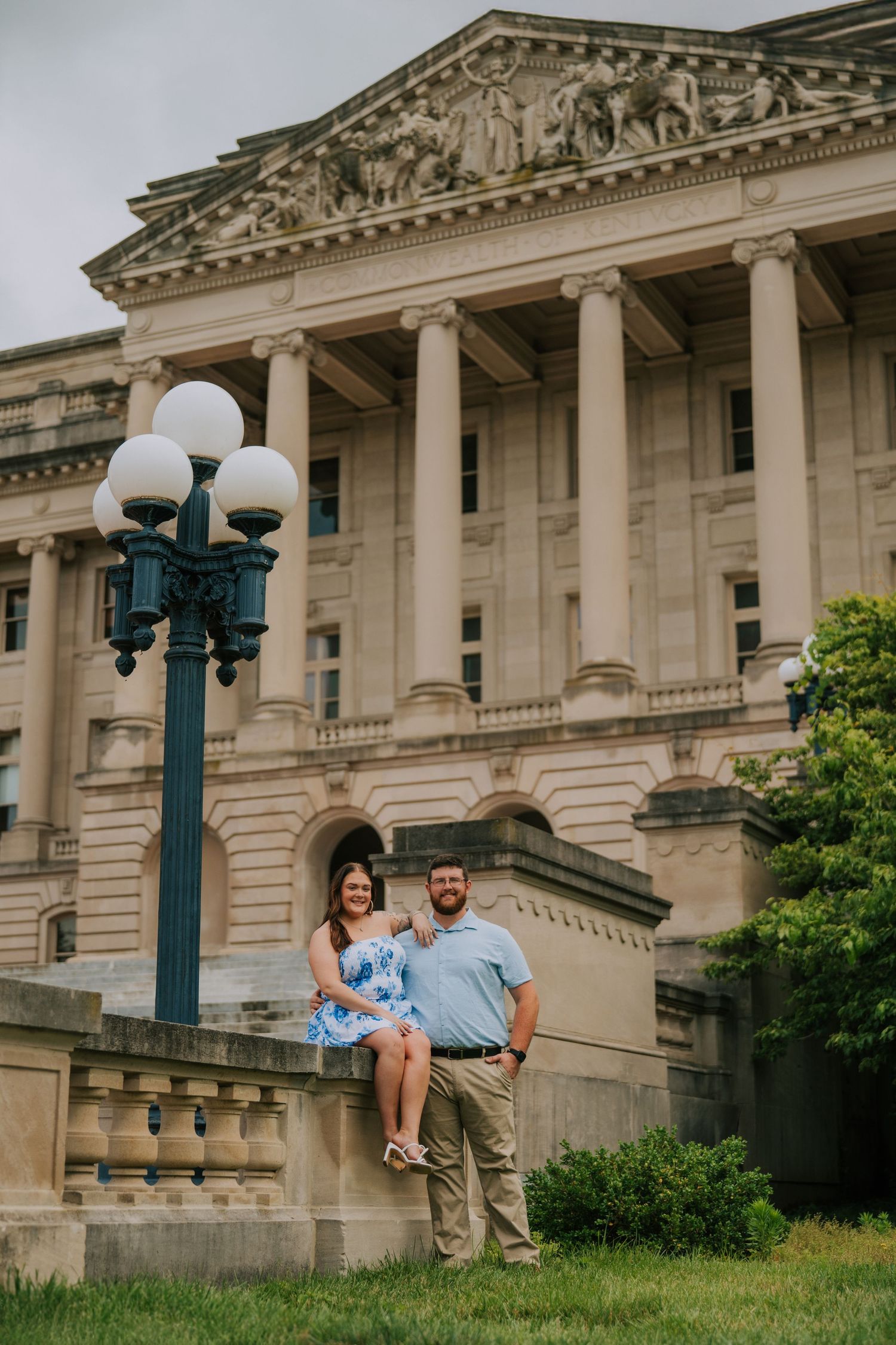 Neoclassical building exterior with grand columns and ornate stone carvings.
