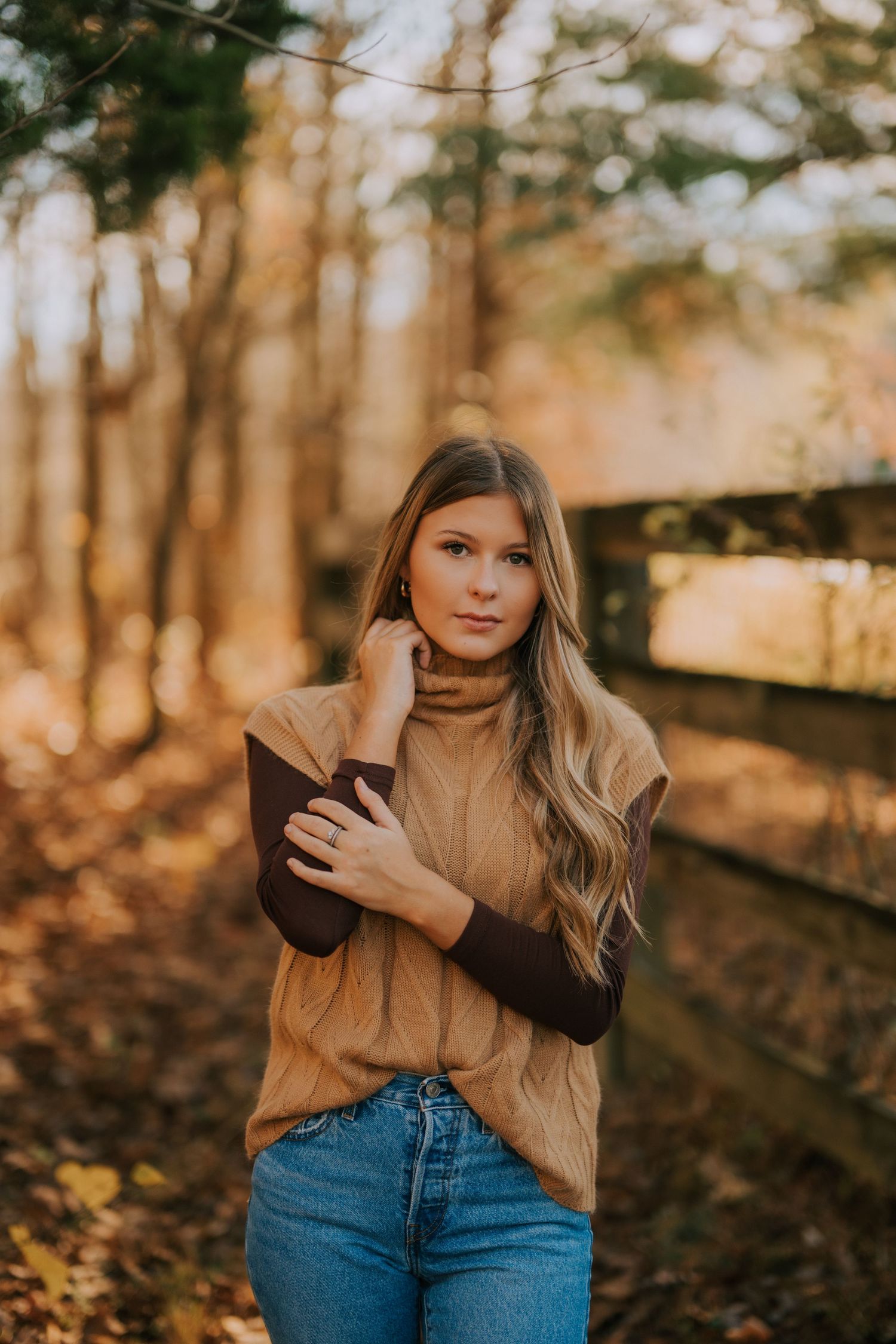 Autumn outdoor portrait with warm lighting and fall foliage.