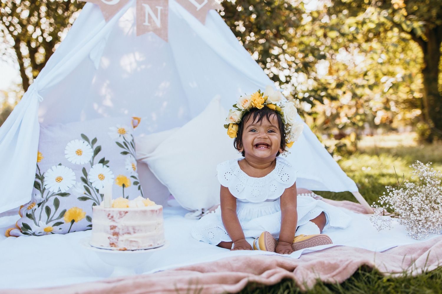 A collection of candid outdoor photos showing joyful moments with white fabric and flower petals in natural sunlight.