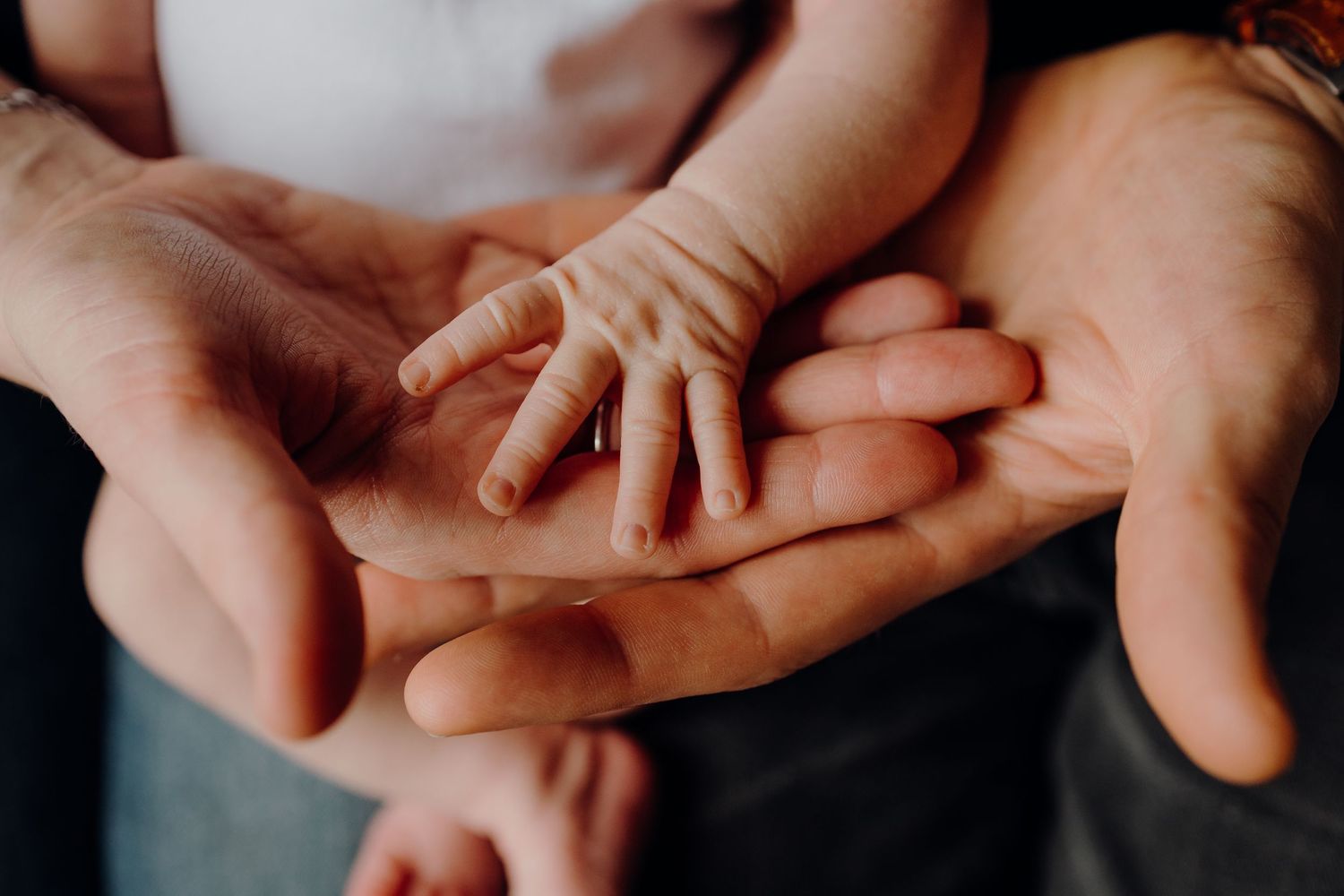 Close-up shots of gentle hands touching and connecting.