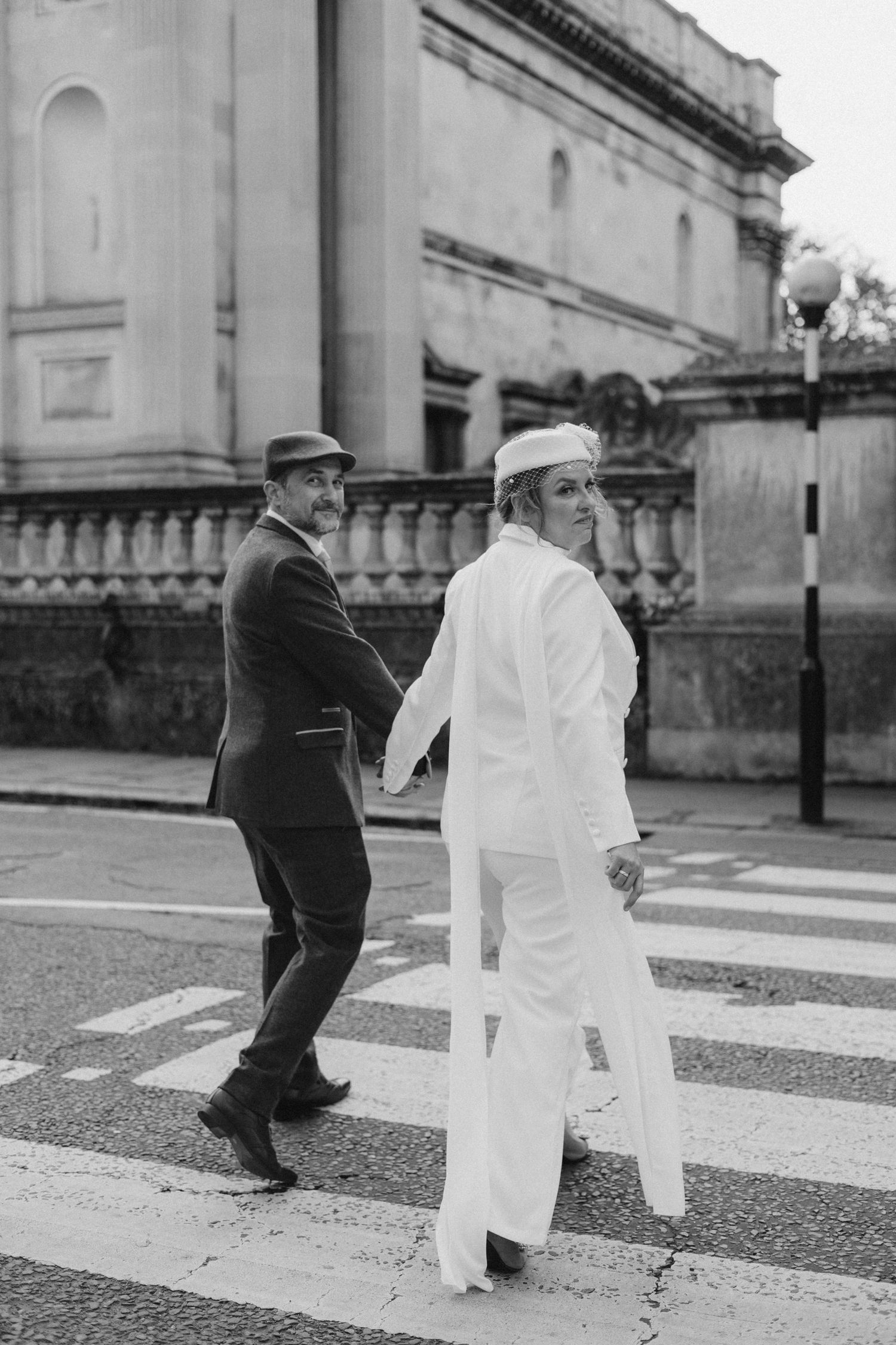 Black and white photo sequence of playful interaction on a crosswalk.