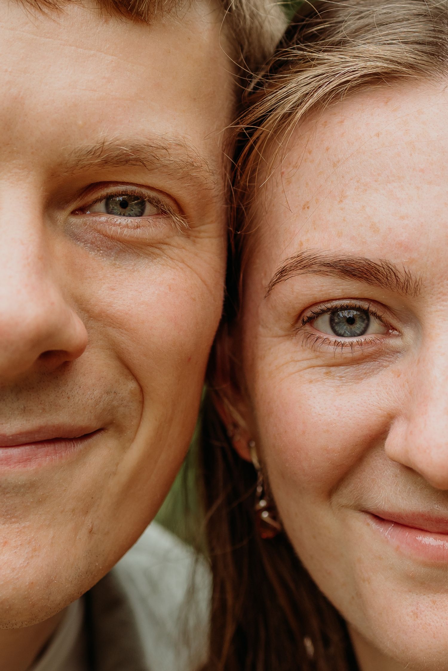 Close-up portrait showing warm smiles and genuine emotion.