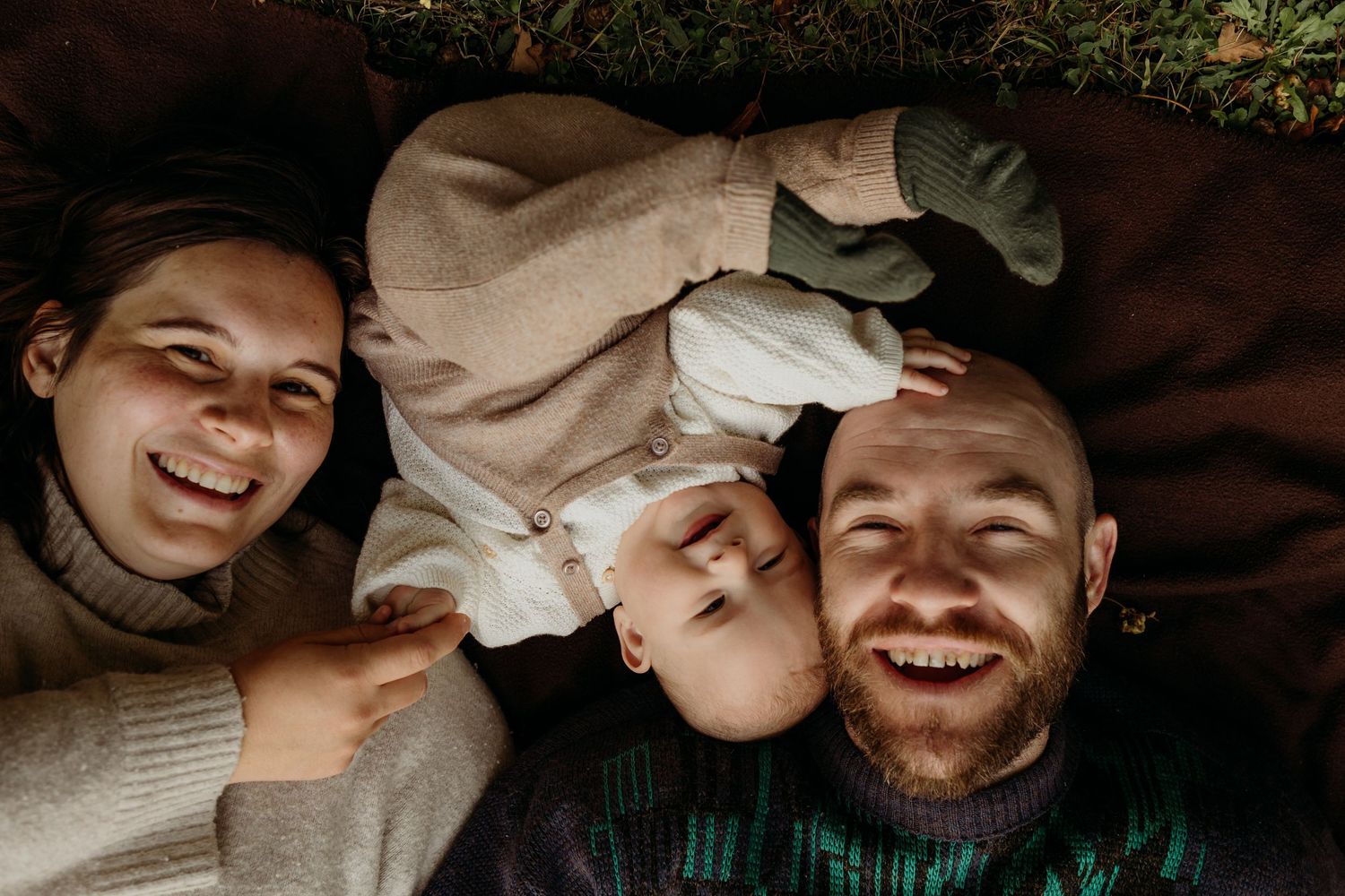 Series of intimate family moments captured in moody black and white photography.