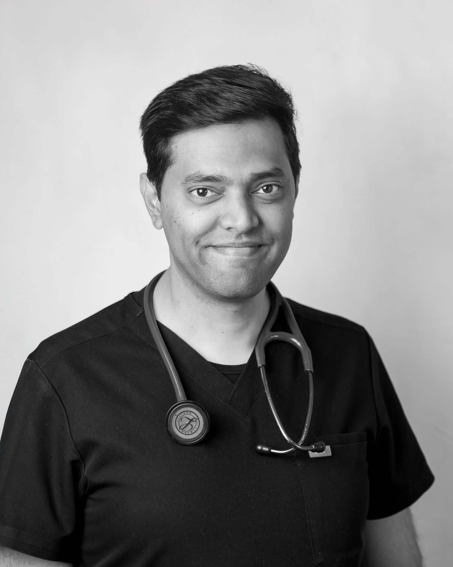 Black and white medical professional portrait with stethoscope.