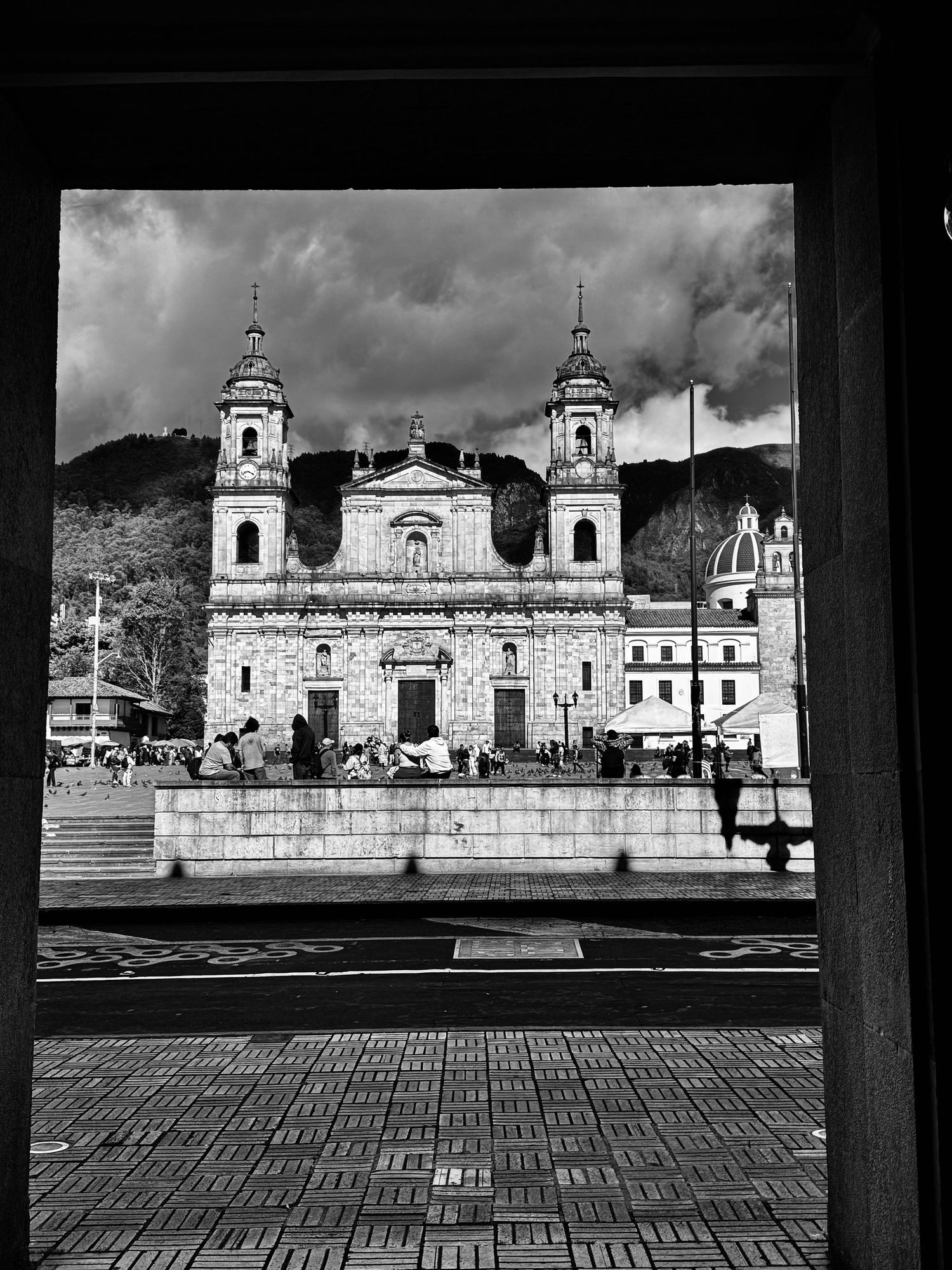 Black and white panoramic view of a historic colonial church facade with ornate architecture.