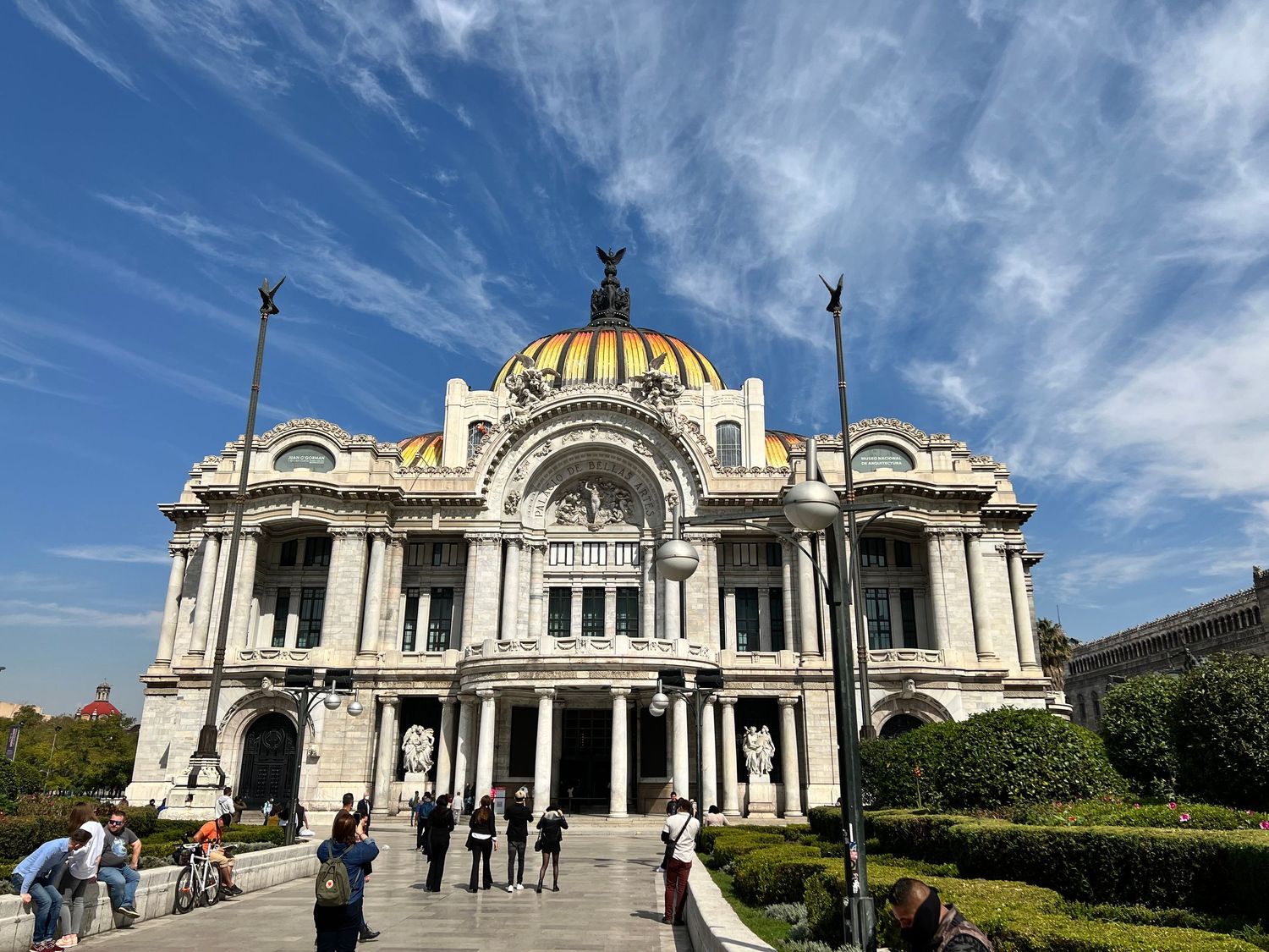 Panoramic view of the Palacio de Bellas Artes in Mexico City under blue skies.