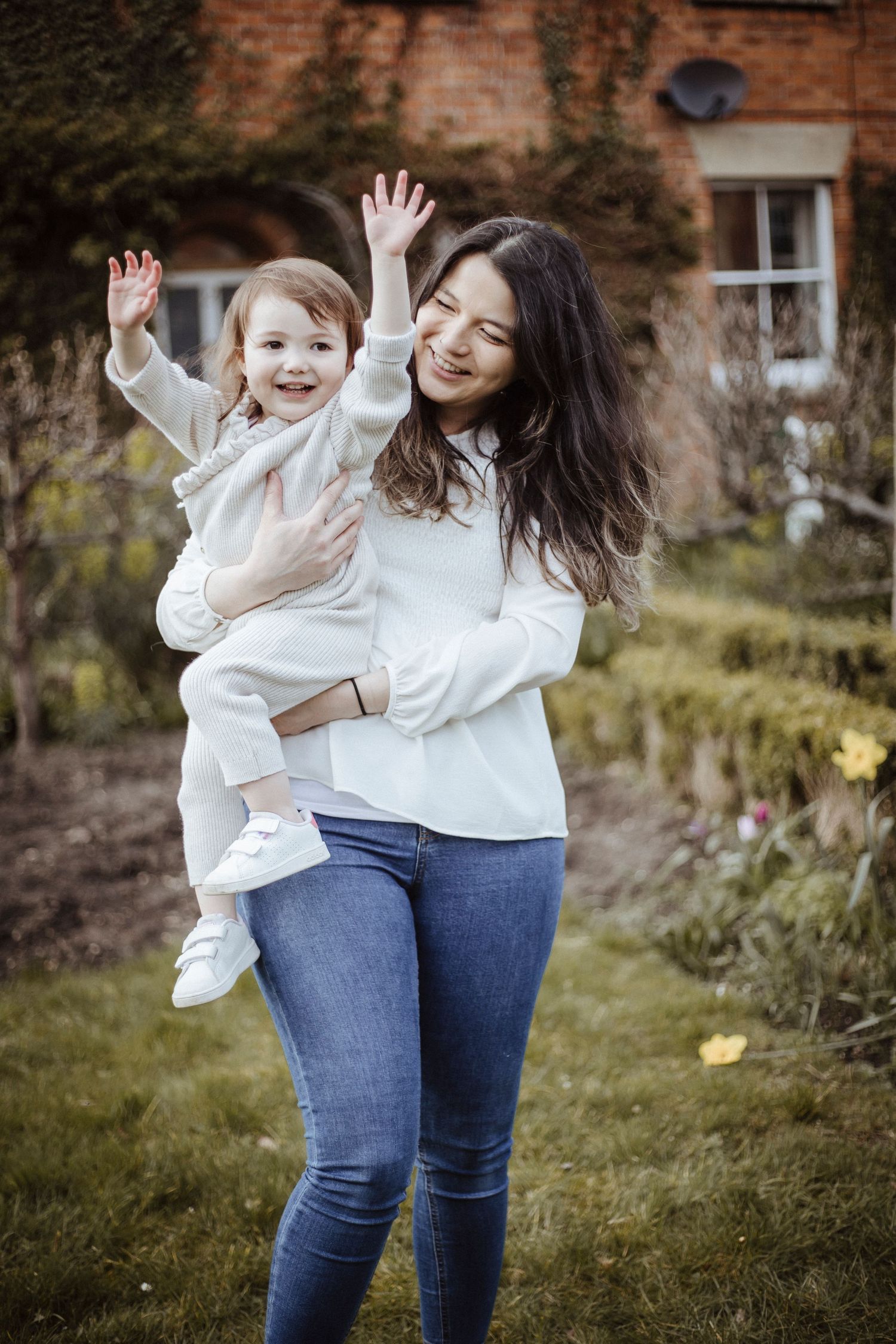 mother and daughter playing in the garden