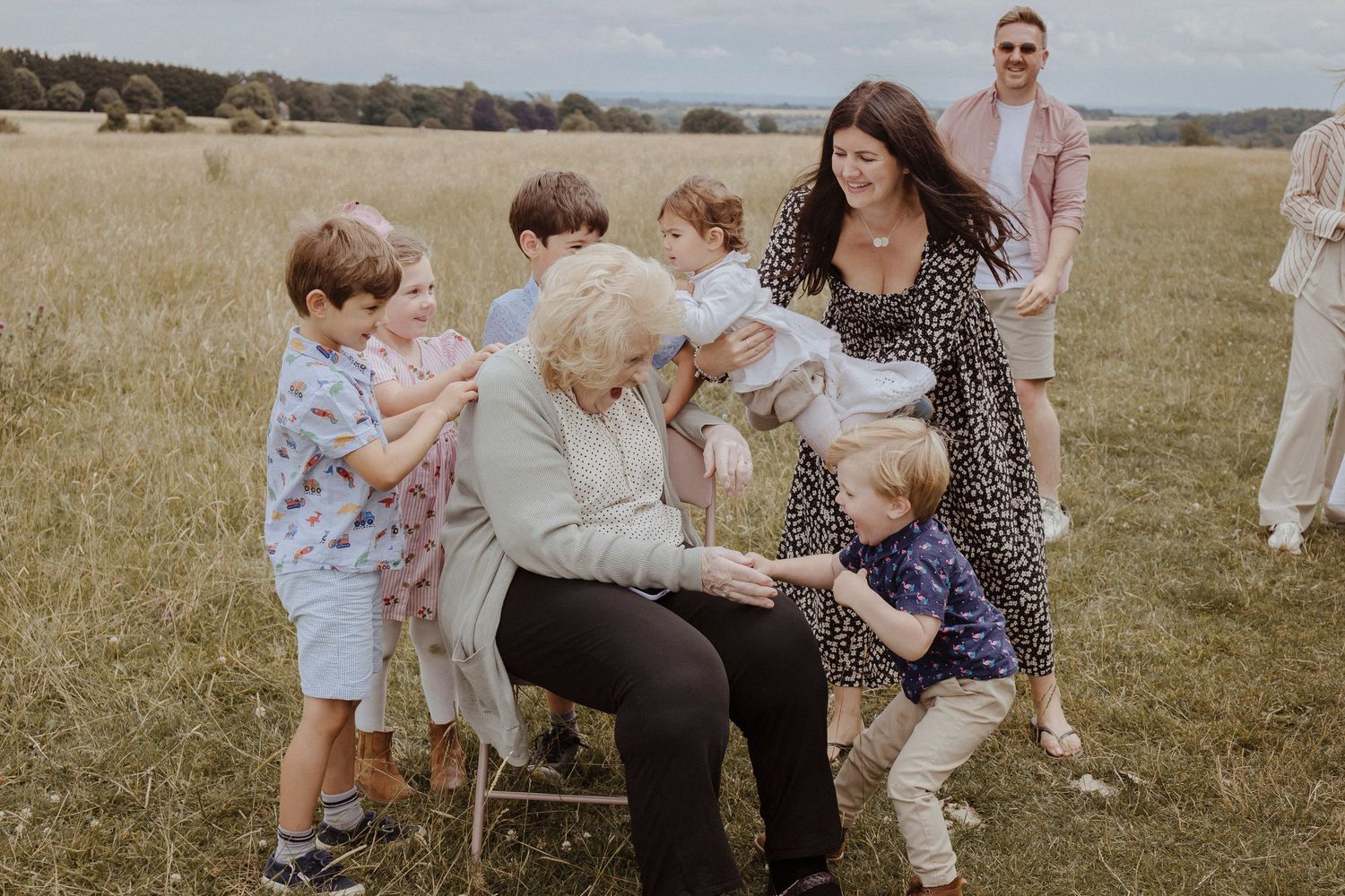 grandchildren running and ticking their grandmother