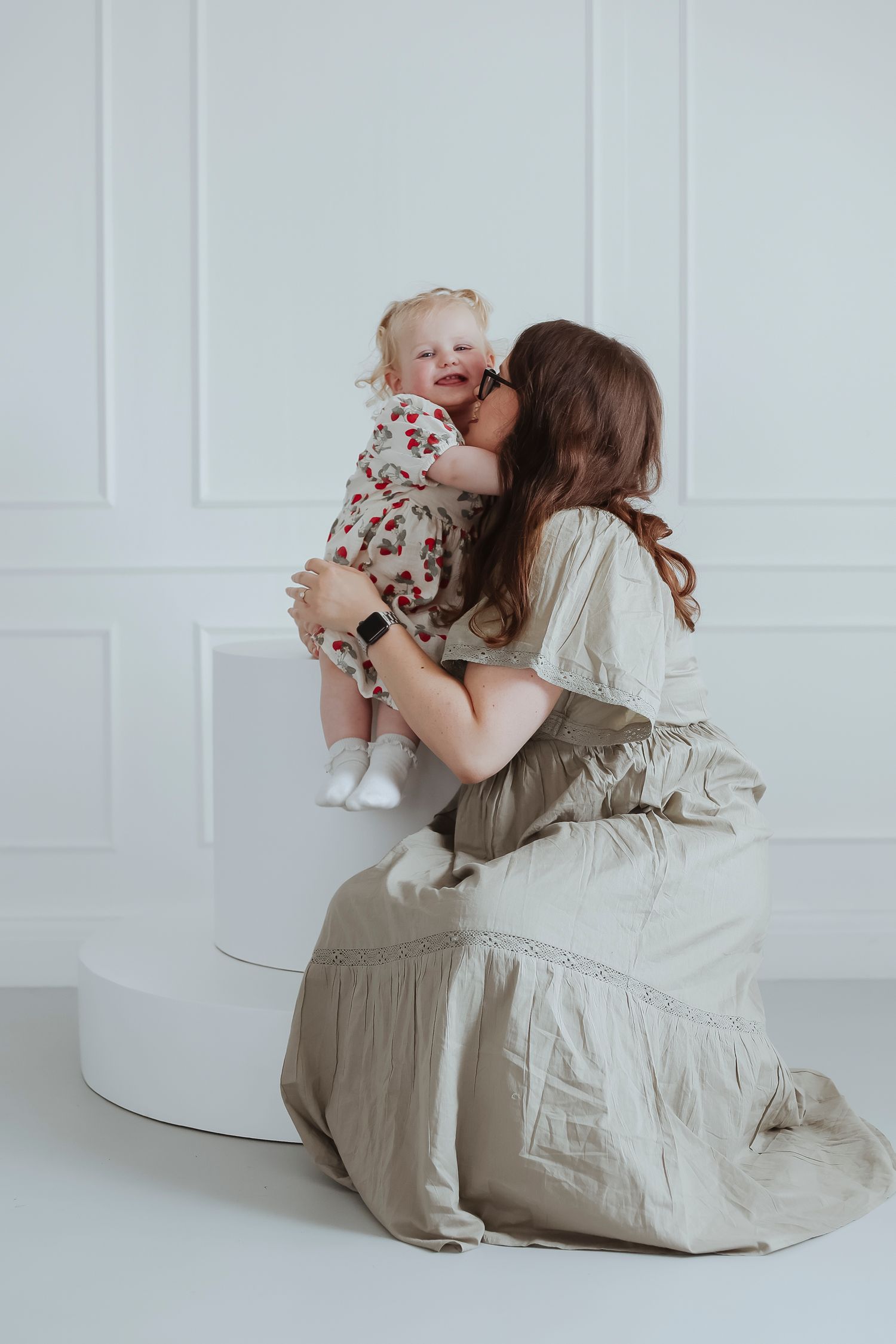 mother and daughter hugging and kissing with joy