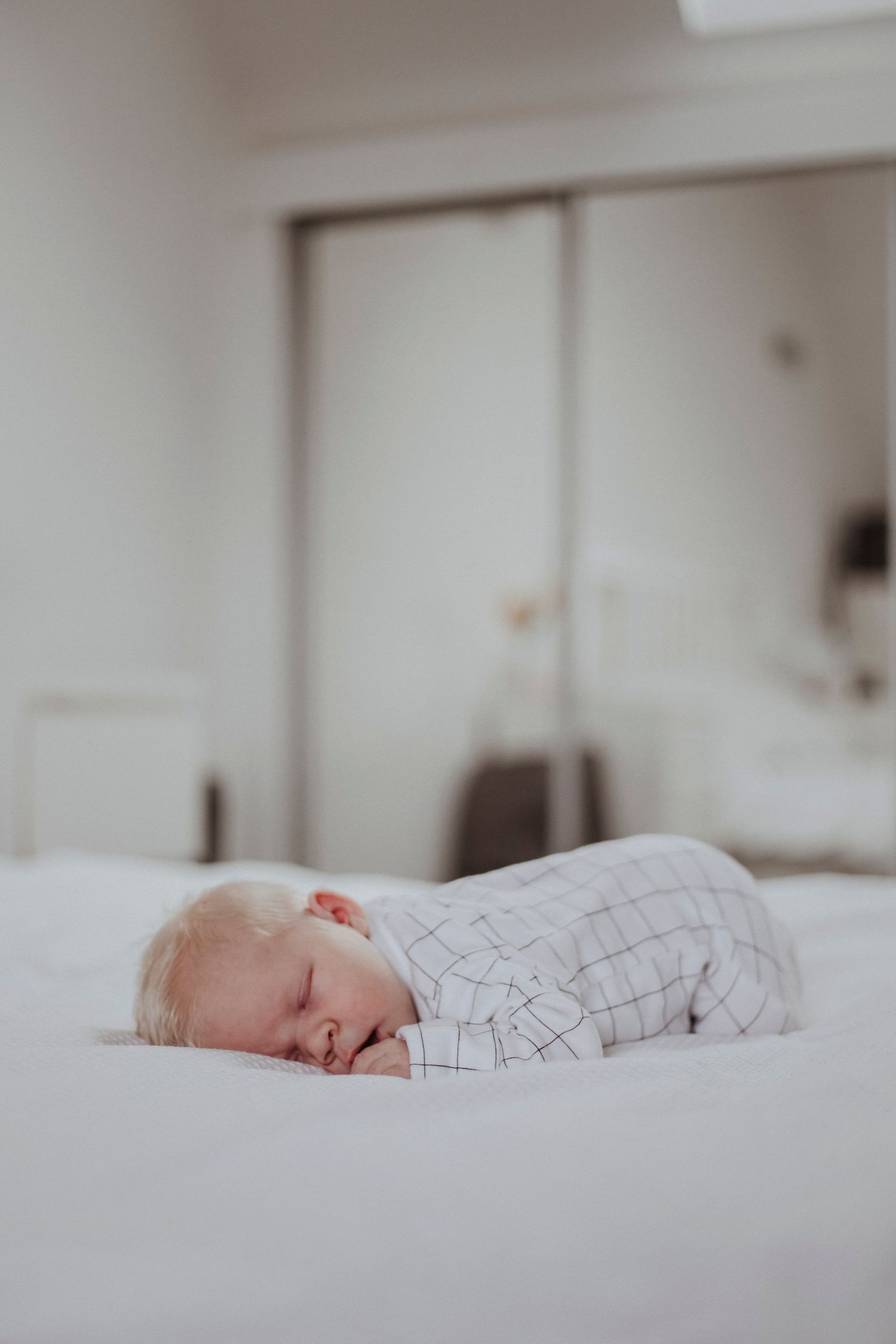 baby asleep on the bed
