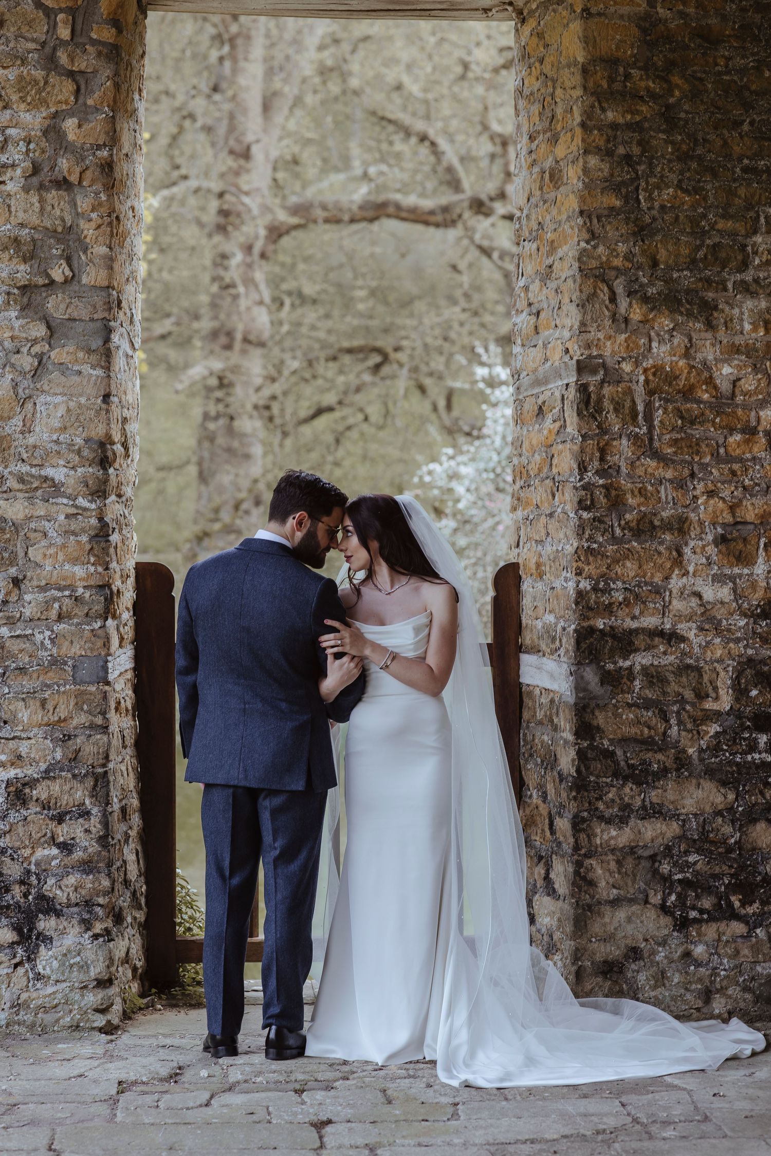 bride and groom touching foreheads staring at each other