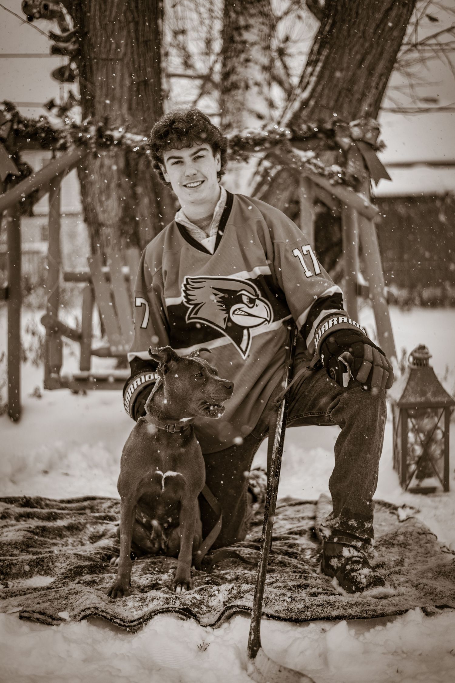 A vintage black and white photo series showing people in winter attire sitting on a snowy ground in a park setting.