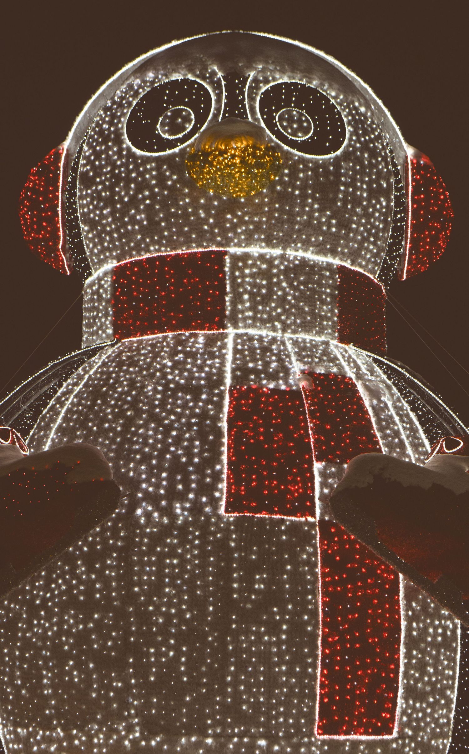 Sequence of chalk drawings showing a simple figure with a red tie against a dark background with white dotted details.