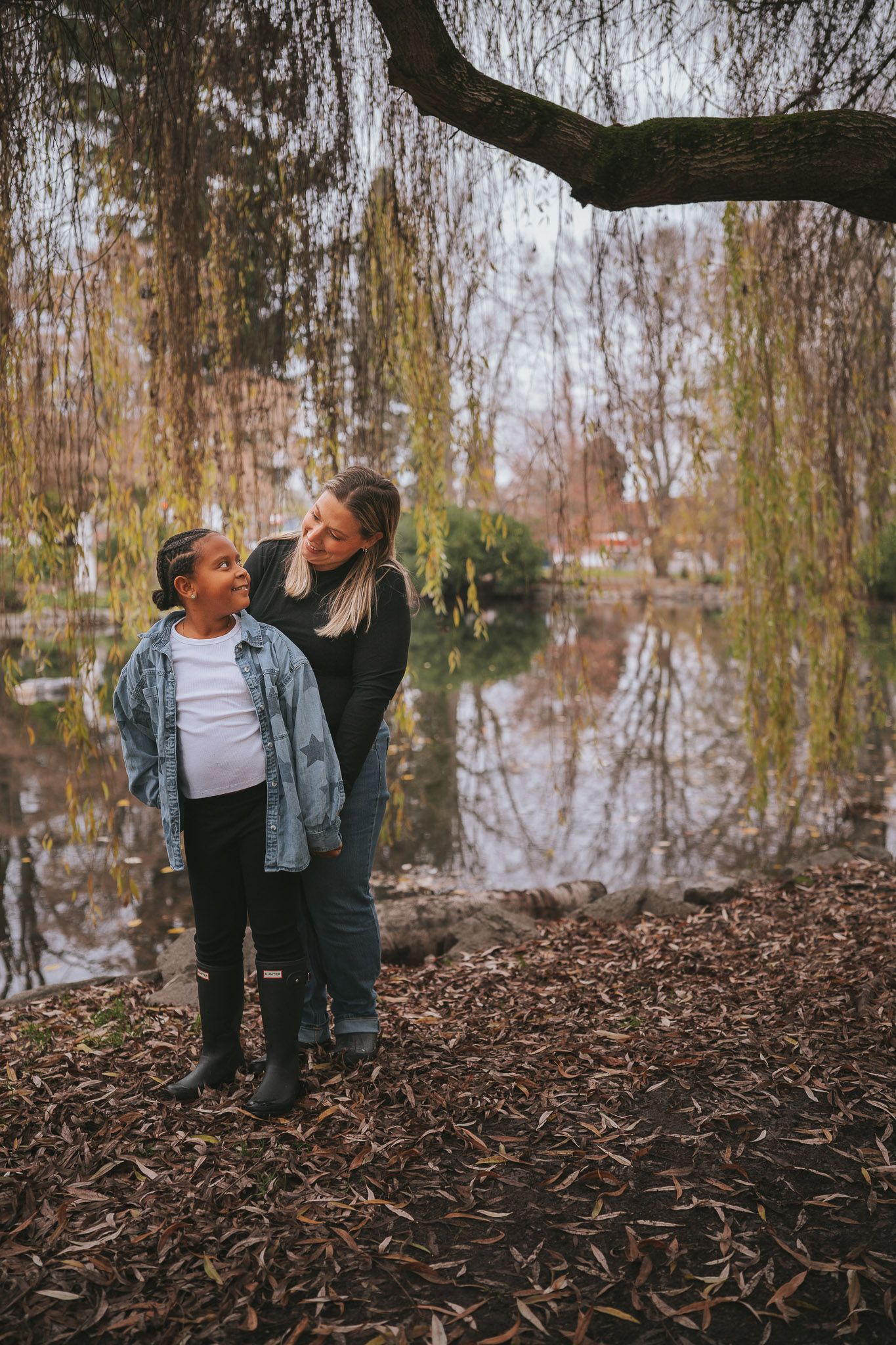 Mother and daughter family photo under a weeping willow tree at Wright Park in Tacoma, Washington.