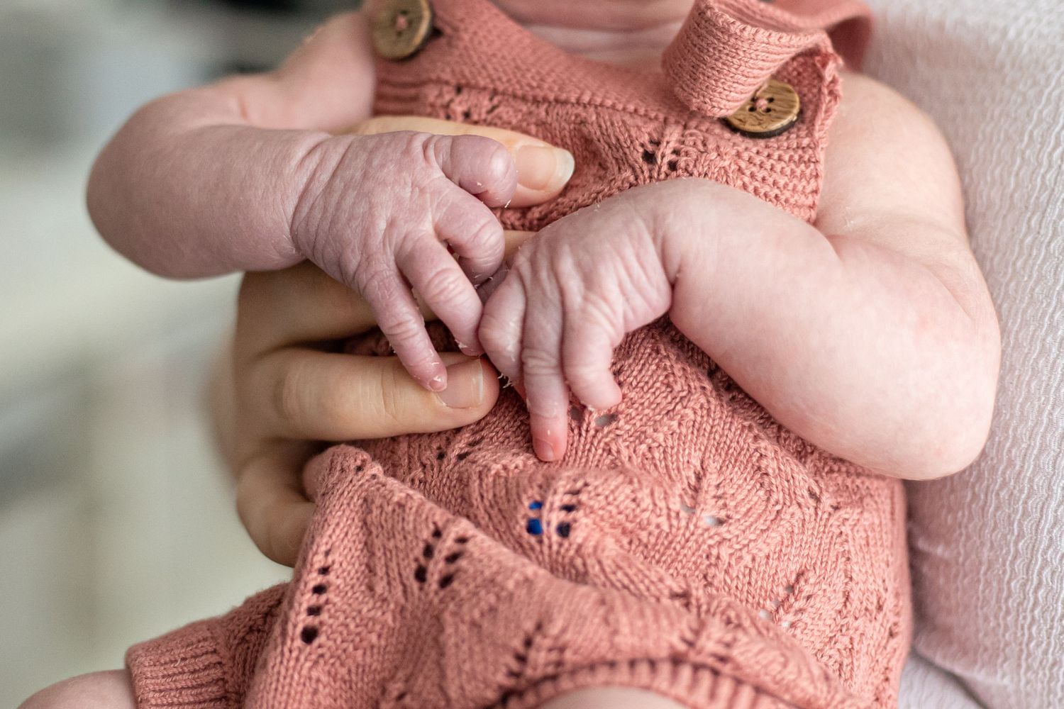 close up of newborn baby girl hands