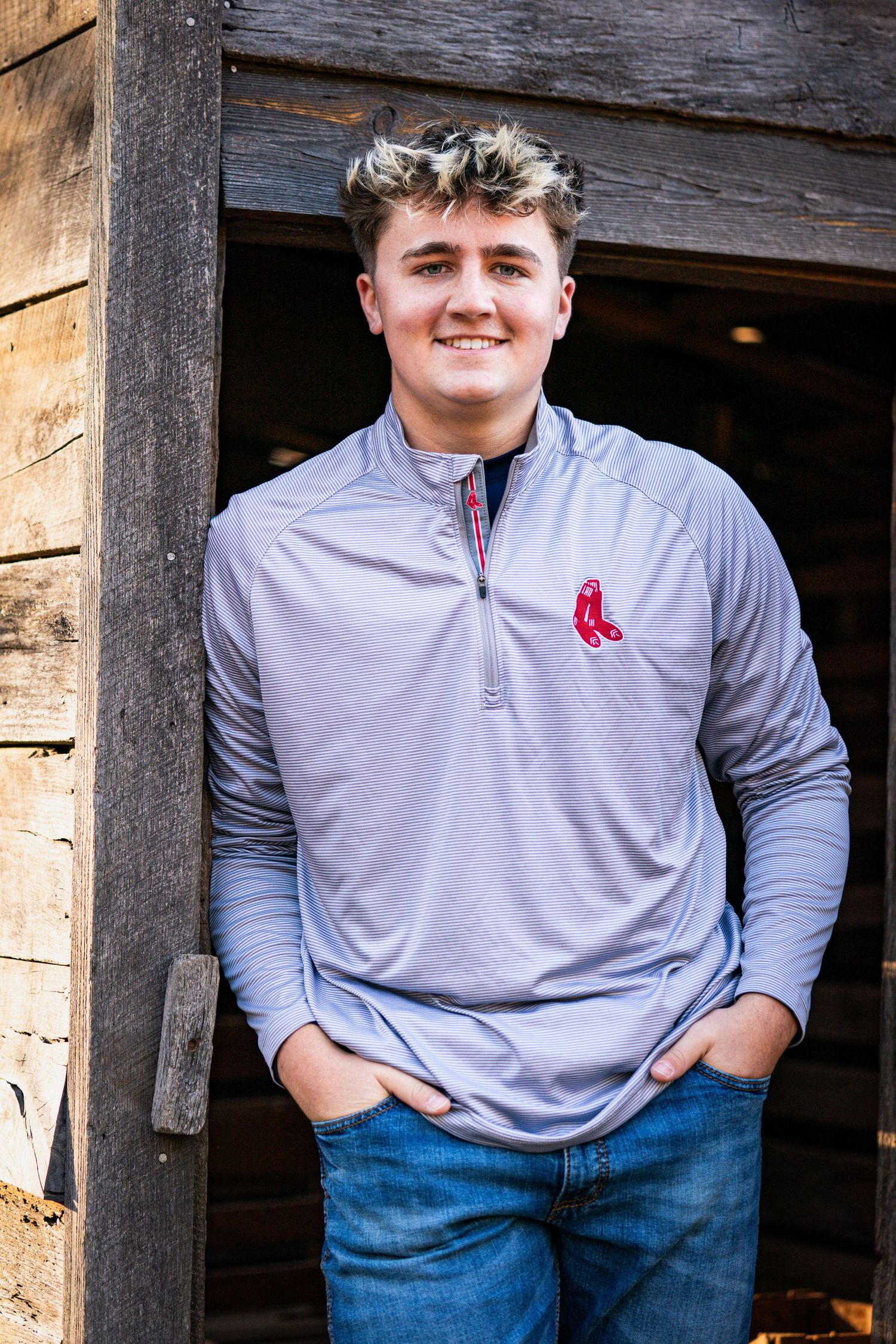 Collage of casual outdoor portraits showing someone wearing a gray Red Sox quarter-zip pullover and jeans against rustic wood.