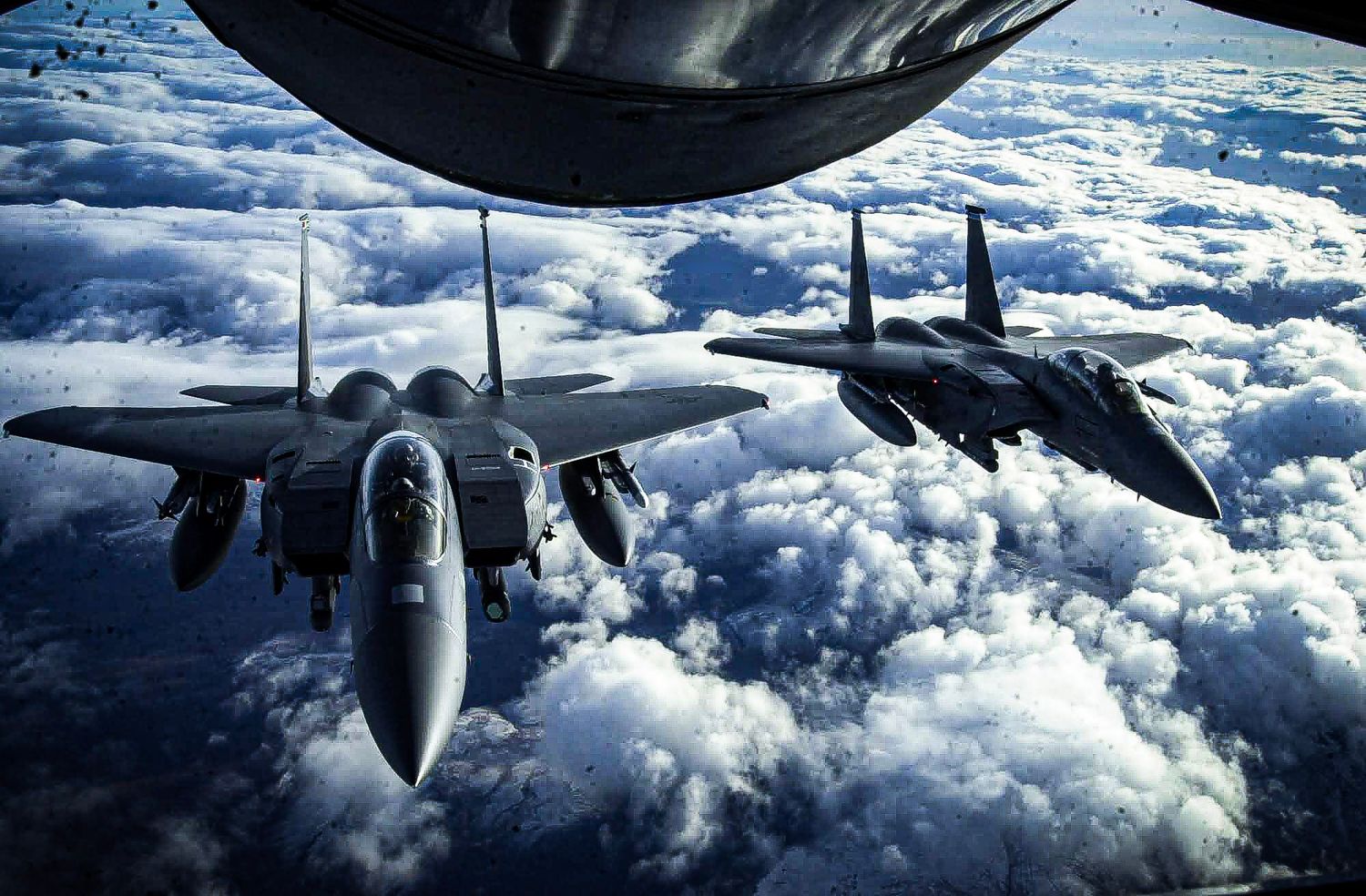 KC-135R refueling two F-15Es over Scotland.